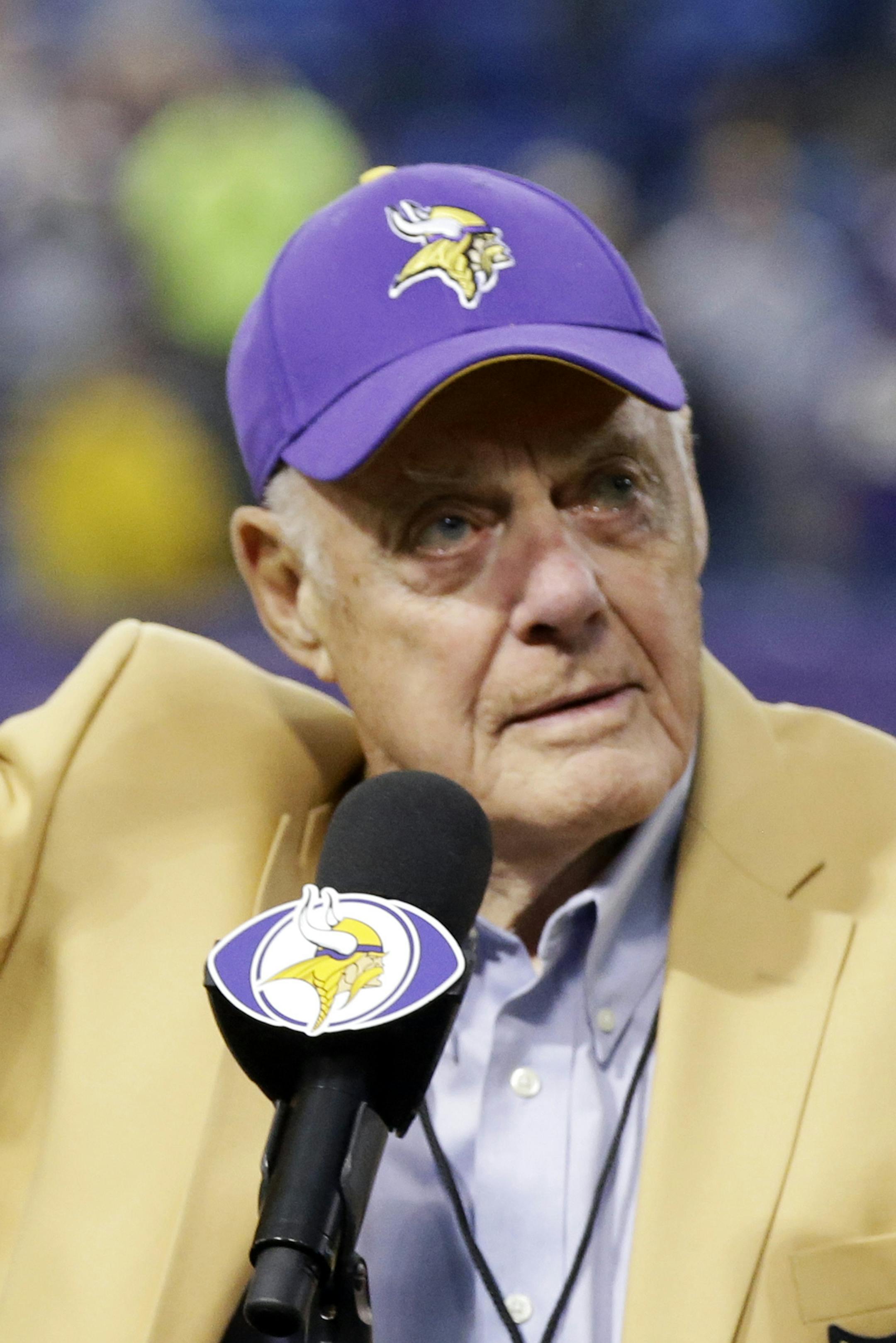 Former Minnesota Vikings Hall of Fame coach waves a final goodbye to the Metrodome in ceremonies following the Vikings NFL football win over the Detroit Lions, Sunday, Dec. 29, 2013, in Minneapolis. The game marked the last in the Metrodome which will be torn down to make room for a new $1 billlion stadium set to open in 2016. (AP Photo/Jim Mone) ORG XMIT: NYOTK