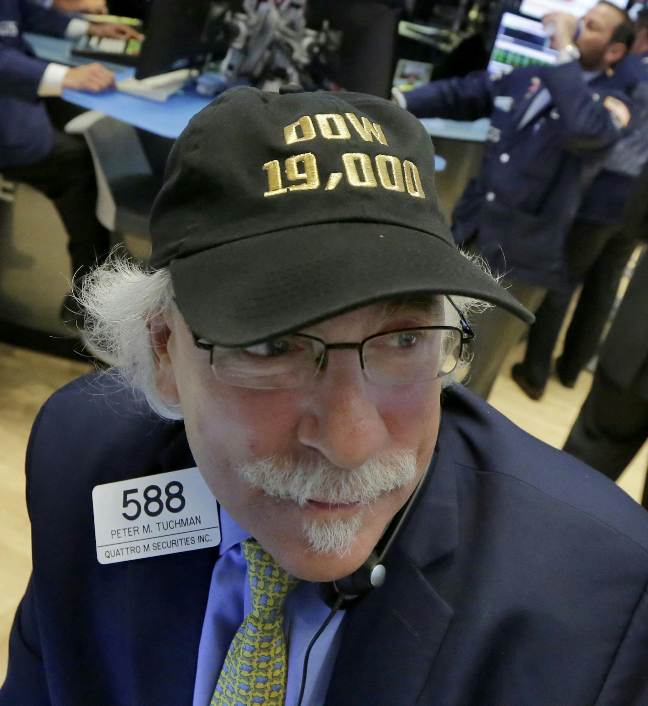 Trader Peter Tuchman wears his "Dow 19,000" cap on the floor of the New York Stock Exchange, Monday, Nov. 21, 2016. U.S. stocks are rising in early trading as the price of oil jumps and energy companies move higher, keeping indexes at record highs. (AP Photo/Richard Drew) ORG XMIT: NYRD101