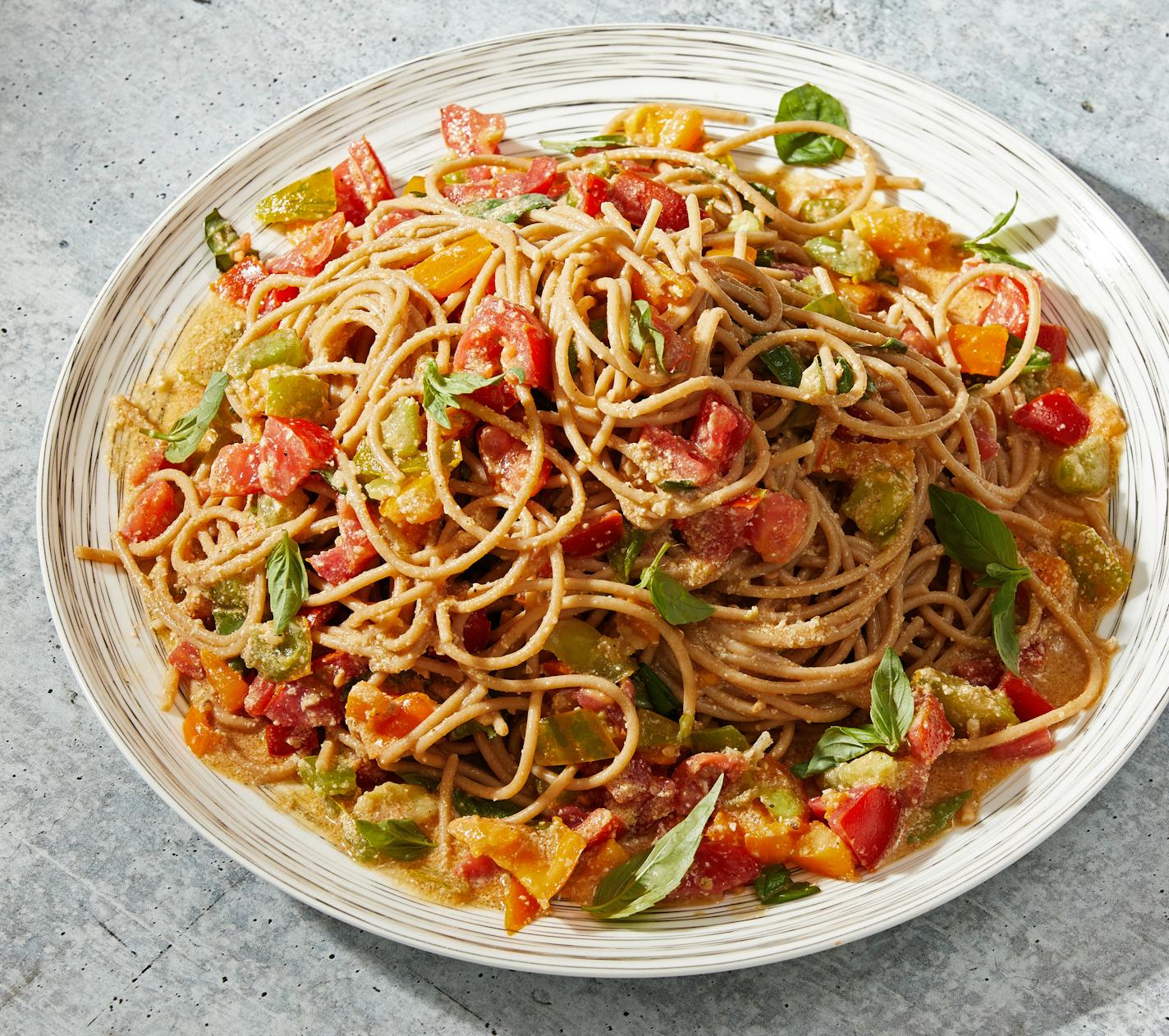 Summer Tomato and Basil Pasta With Pine Nut Sauce. MUST CREDIT: Photo by Tom McCorkle for The Washington Post.