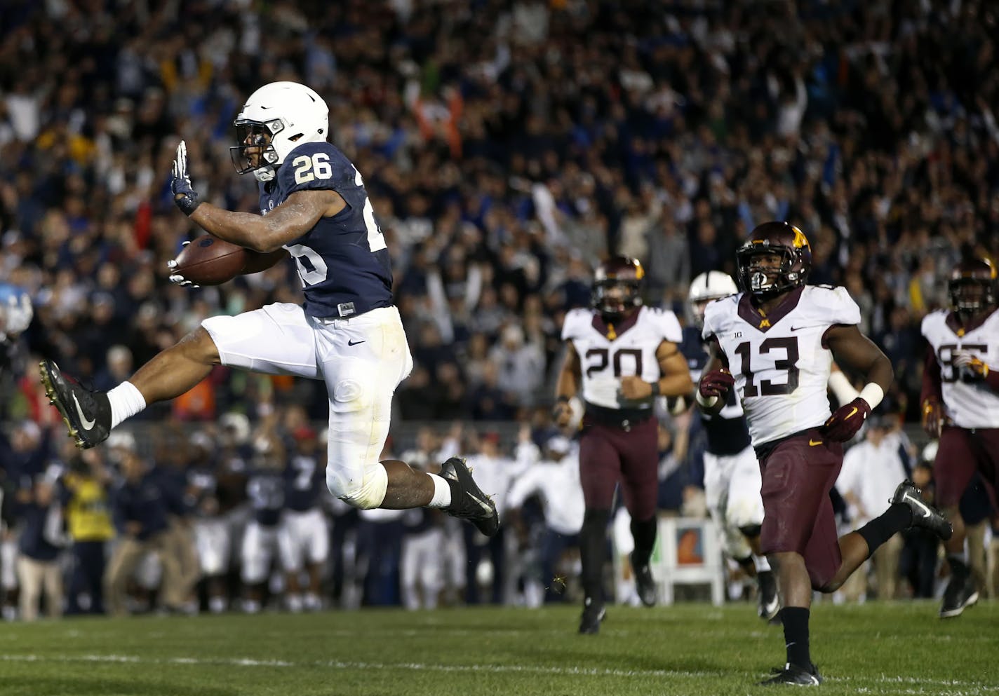 Penn State's Saquon Barkley (26) takes it in for the winning touchdown against Minnesota during overtime of an NCAA college football game in State College, Pa., Saturday, Oct. 1, 2016. (AP Photo/Chris Knight) ORG XMIT: PACK114