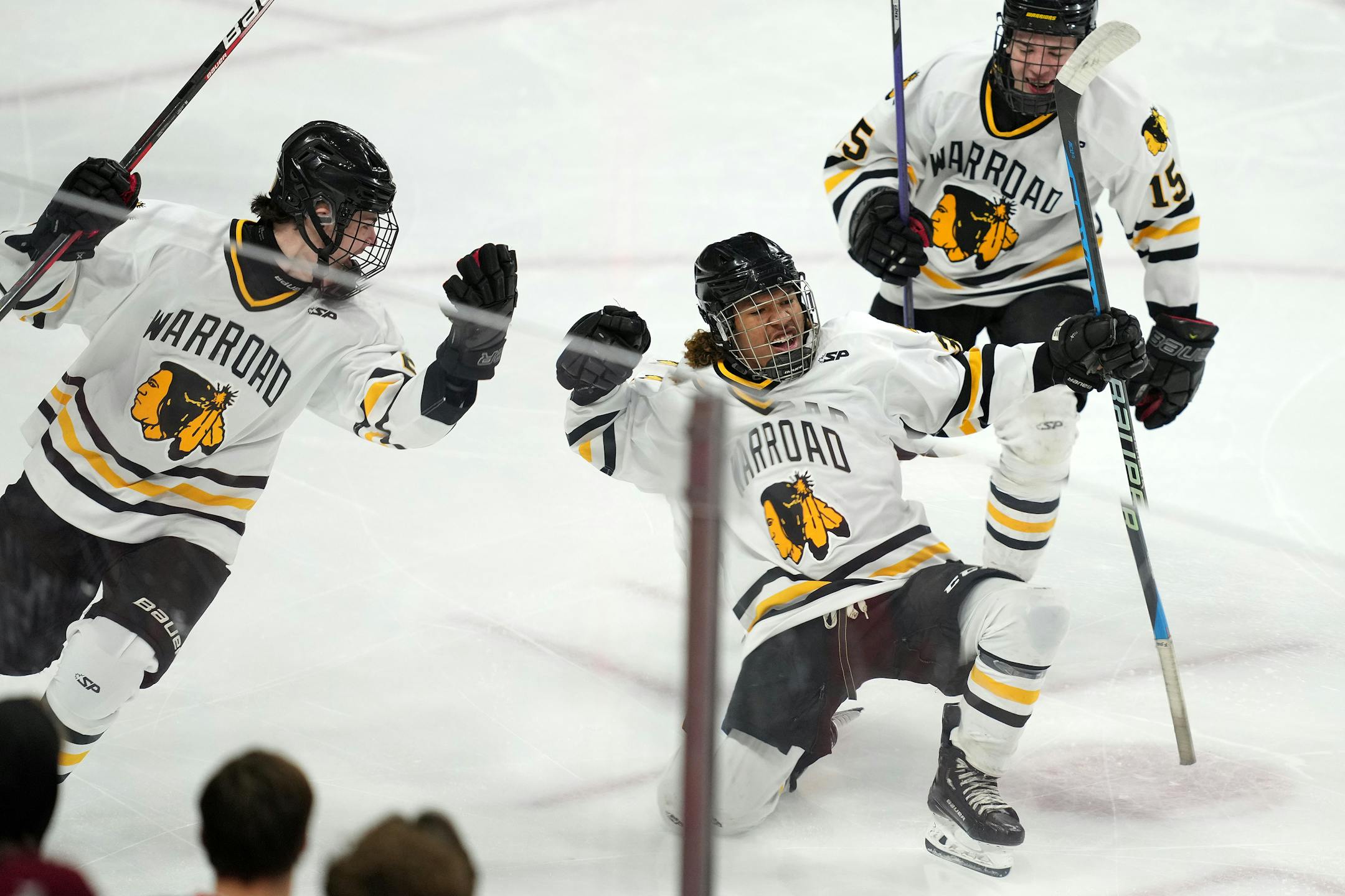 Warroad forward Peyton Sunderland (33) celebrates after scoring in the first period.