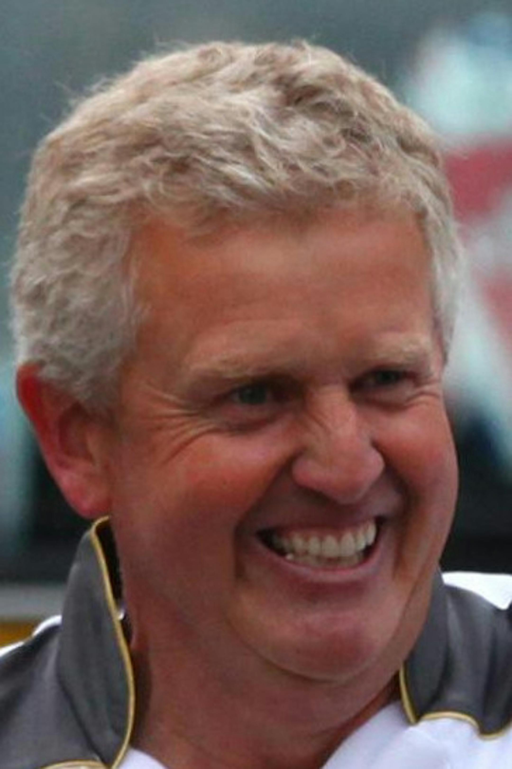 This image made available by LOCOG shows Colin Montgomerie carrying the Olympic Torch, on Day 24 of the London Torch Olympic Relay 2012 , in Aberdeen, Monday, June 11, 2012. (AP Photo/Gareth Fuller/LOCOG) ORG XMIT: MIN2013062018221264