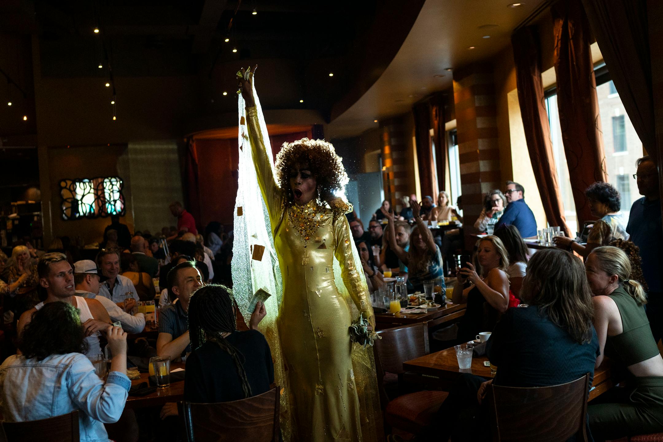 Cee Cee Russell performs his set while wearing a "Beauty and the Beast" inspired dress at Crave on Sunday, June 20, 2021, in Minneapolis. ] ANTRANIK TAVITIAN • anto.tavitian@startribune.com