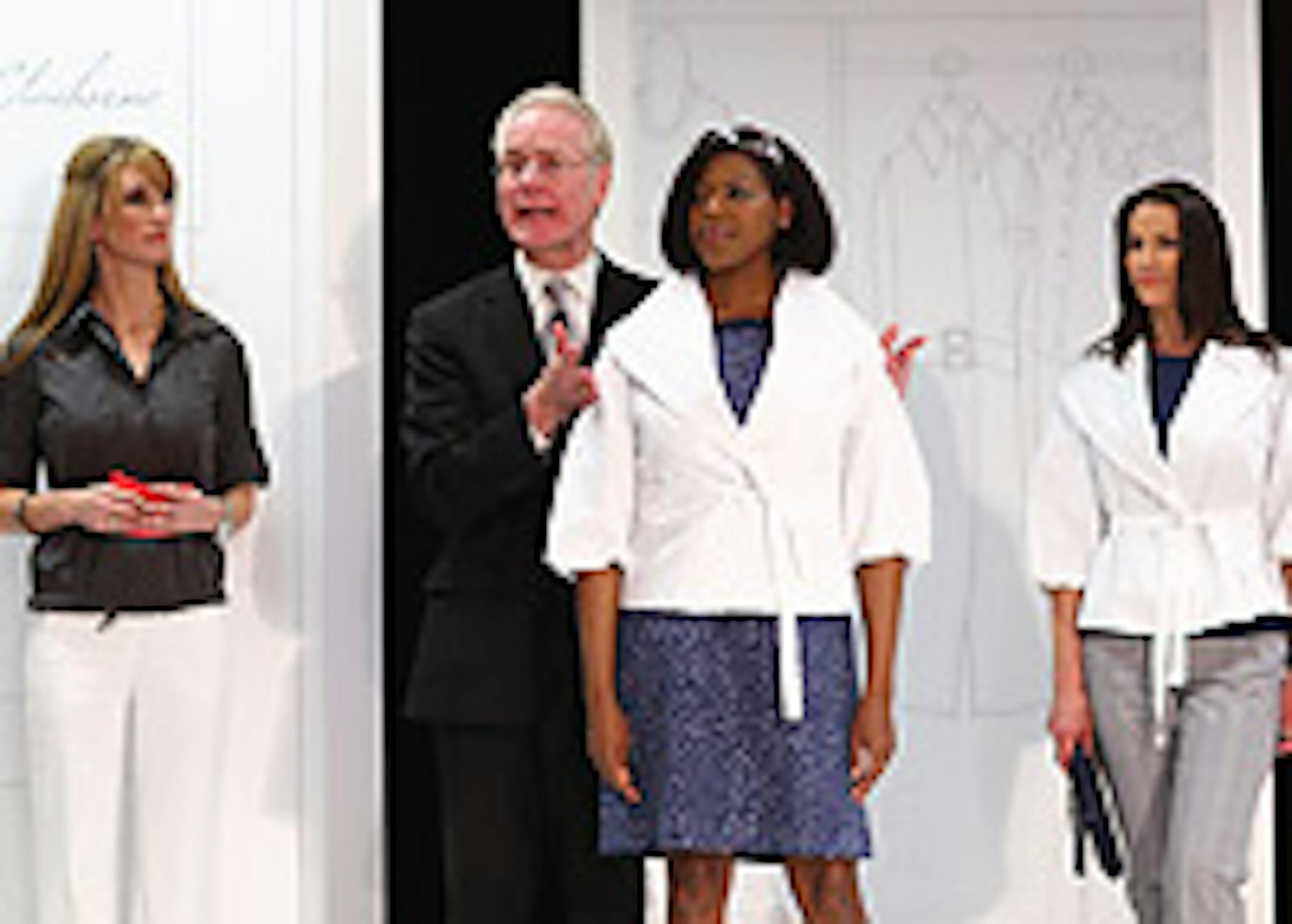 Tim Gunn praises a shawl collar belted jacket and print dress.