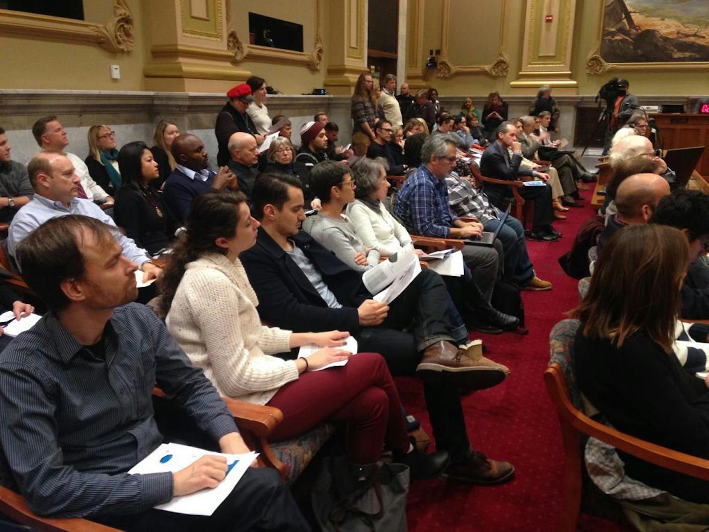 People sat in Minneapolis ciy council chambers during a hearing and adoption for th City's budget for 2017.