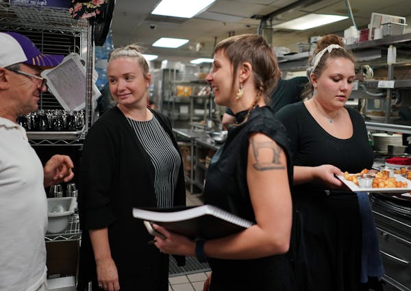 Co-owner Steve Meyer talked with Hell's Kitchen managers Kjersti Granberg, left, and Jessica Cram, center, who helped turn the restaurant around.