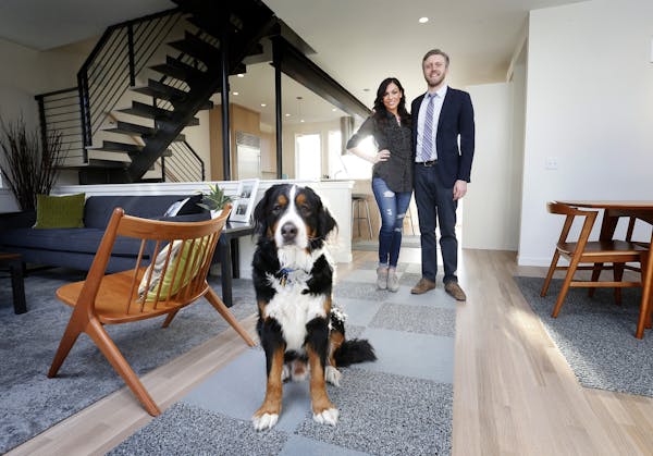 Peter and Starla Ihrig with their dog, Gus, inside their newly remodeled Minneapolis home.