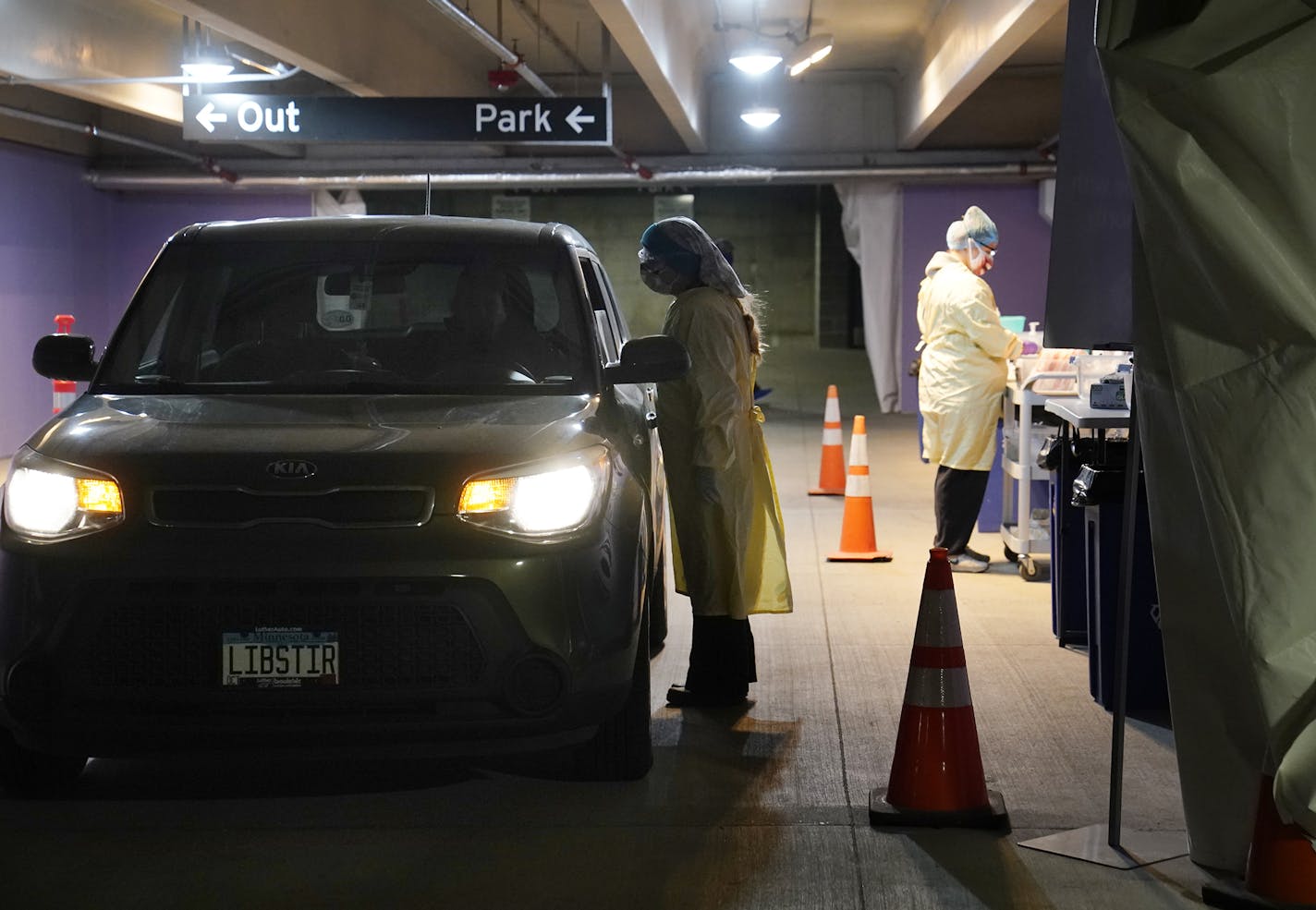 HealthPartners began its transition to indoor and winterized drive-up COVID testing sites across the Twin Cities and western Wisconsin, including in the HealthPartners corporate headquarters parking ramp where Robyn Wallin, an LPN, tested a person in the drive-up Wednesday in Bloomington. ] DAVID JOLES • david.joles@startribune.com