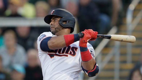 Twins designated hitter Nelson Cruz follows through on a single in the first inning of a spring training game Feb. 29
