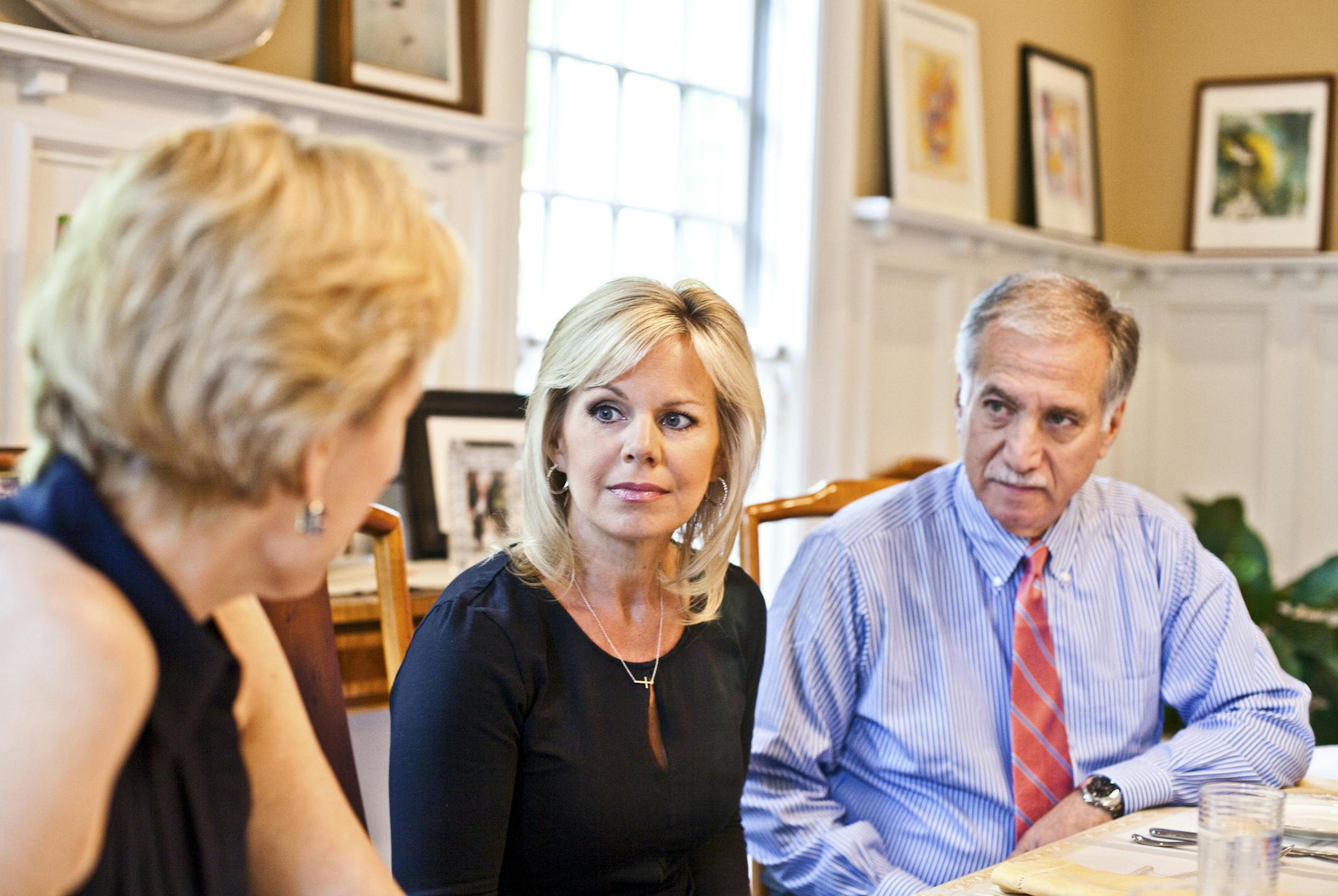 Gretchen Carlson, center, with her attorneys Martin Hyman, right, and Nancy Erika Smith at Smith&#xed;s home in Montclair, N.J., July 12, 2016. In a first public statement since her sexual harassment suit against Fox News boss Roger Ailes, Carlson said that she felt it was finally time to speak up. &#xec;I just wanted to stand up for myself, first and foremost,&#xee; she said. (Bryan Anselm/The New York Times)