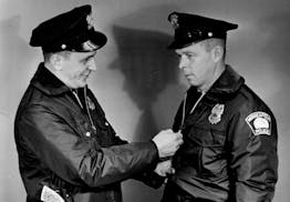 Patrolman Richard A. Kroger and Patrolman Donald M. Hallberg showed the new winter uniforms in October 1963.