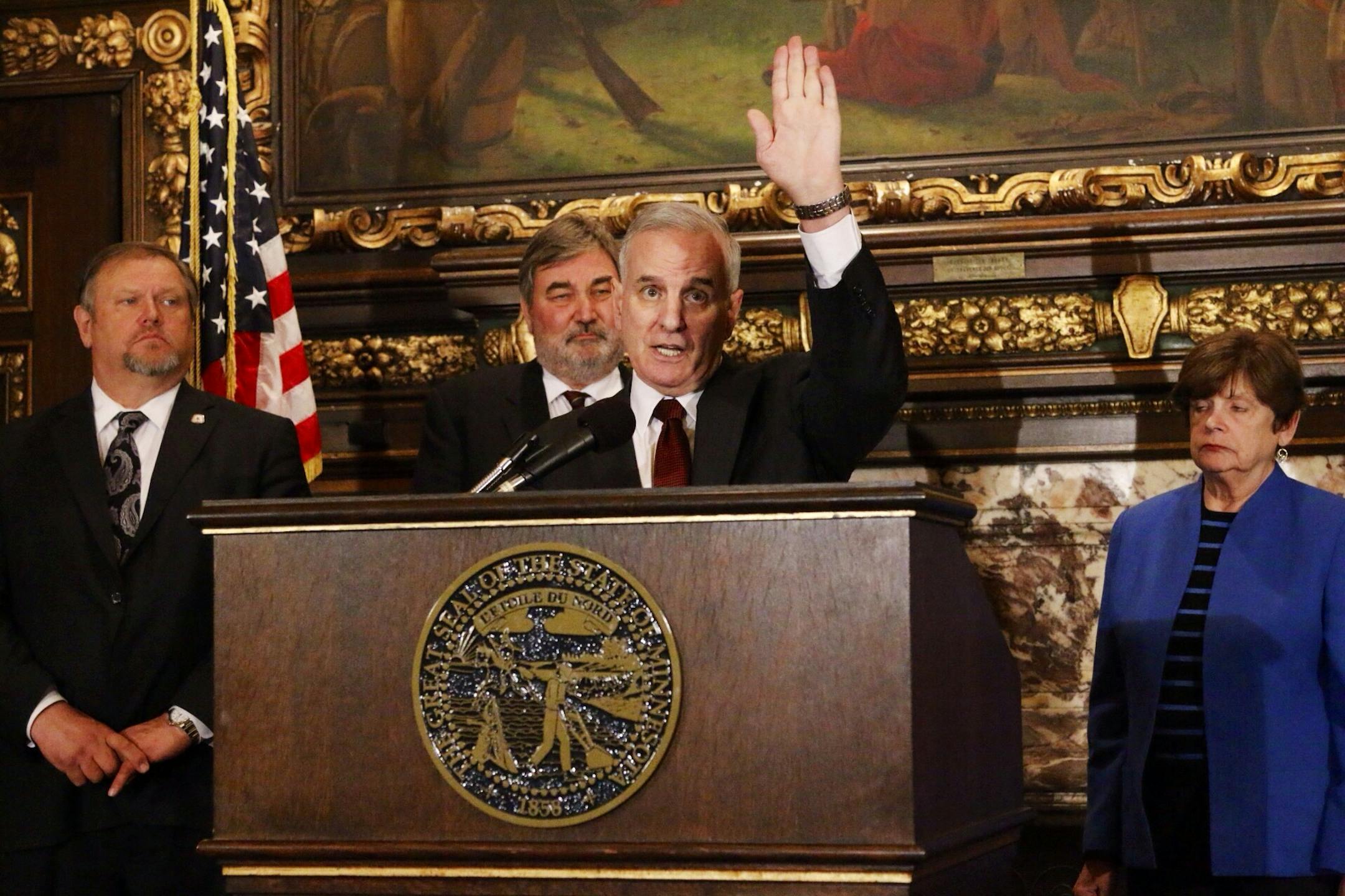 Governor Dayton with senators Thomas Bakk (left) and Sen Ann Rest, DFL.