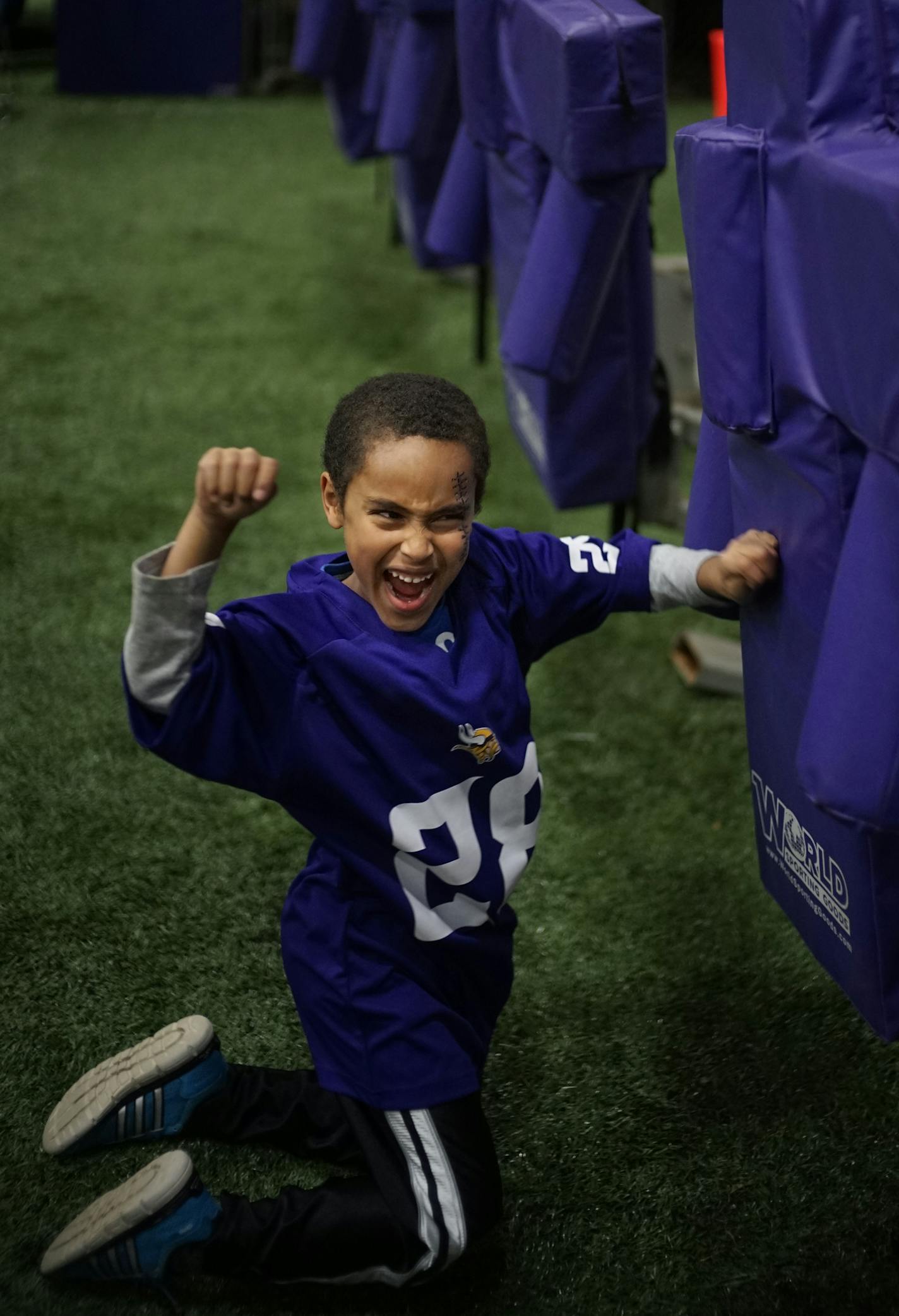 At the Family Fun Fest at the Vikings Winter Park field house in Eden Prairie, Mesfin Jensen,6, worked things out with the tackling dummy .] Richard Tsong-Taatarii/rtsong-taatarii@startribune.com