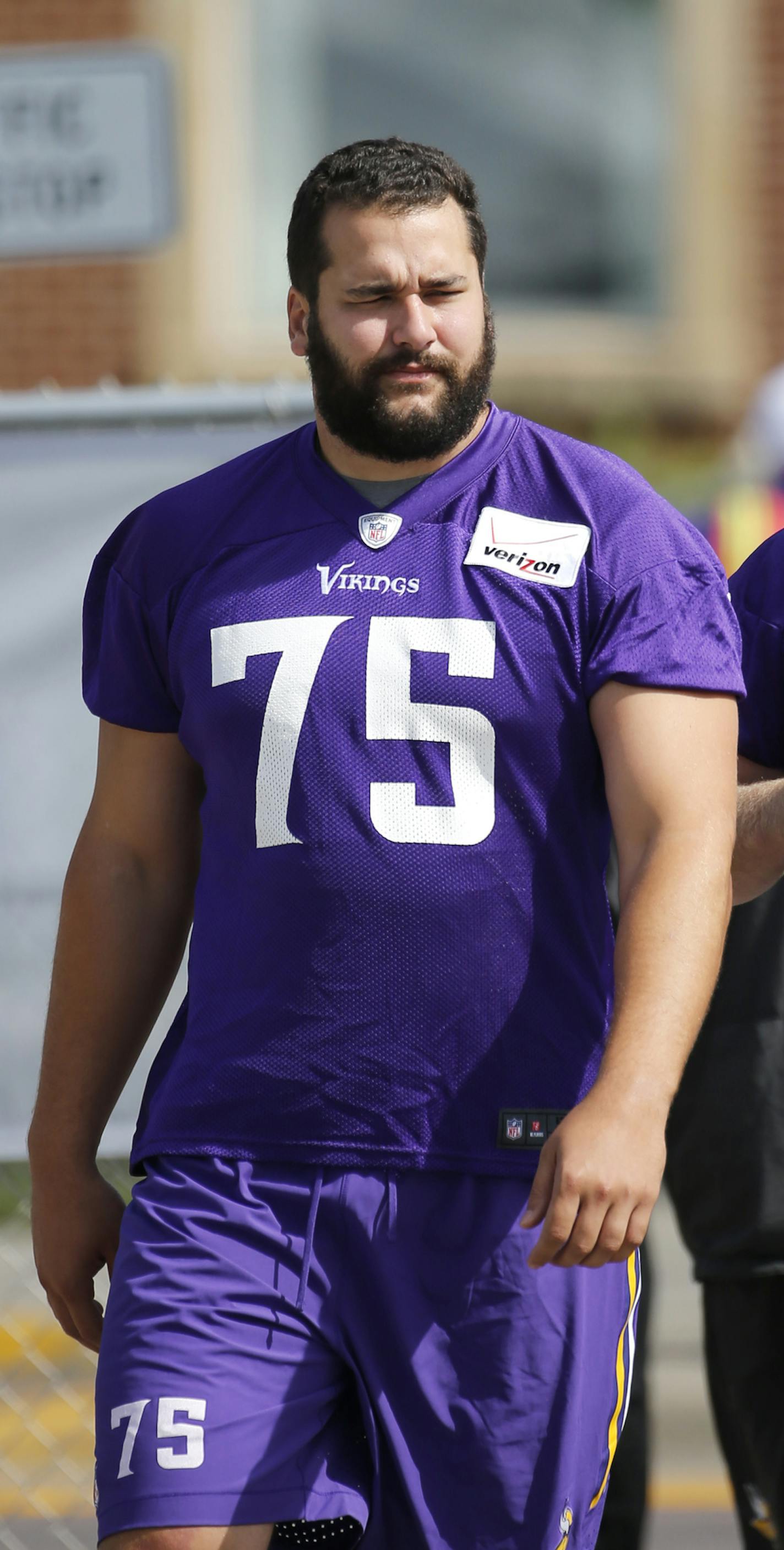 Minnesota Vikings tackle Matt Kalil walks to the practice fields at an NFL football training camp on the campus of Minnesota State University Sunday, July 26, 2015, in Mankato, Minn. (AP Photo/Charles Rex Arbogast)