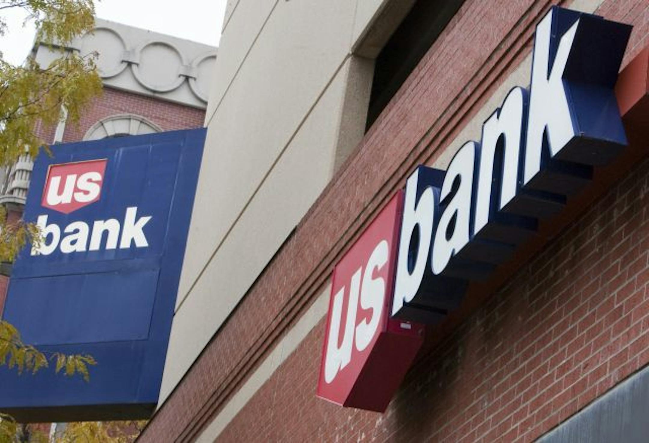 FILE - In this Oct. 20, 2009 file photo, signs on a US Bank branch in Omaha, Neb., are shown.