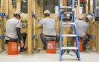 This photo provided by The Home Depot shows students training at the The Home Depot Foundation and HBI's Ft. Stewart Program on a job site in Ft. Stew