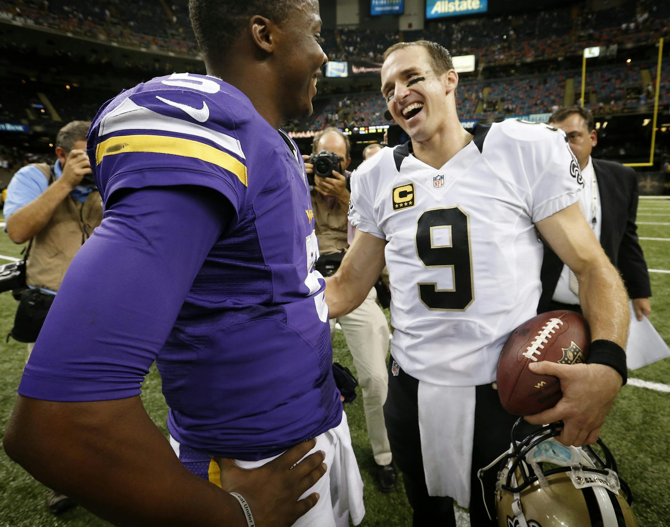 Minnesota Vikings rookie quarterback Teddy Bridgewater (5) spoke to Saints quarterback Drew Brees (9) at the end of the game. Bridgewater replaced injured starting quarterback Matt Cassel in the second quarter. ] CARLOS GONZALEZ cgonzalez@startribune.com - September 21 , 2014 , New Orleans, LA, Mercedes Benz Superdome, NFL, Minnesota Vikings vs. New Orleans Saints