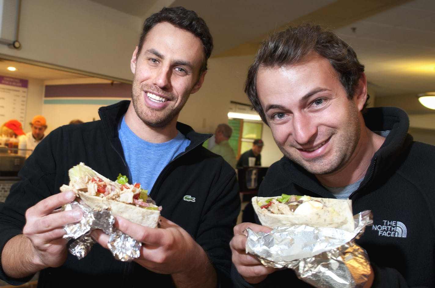 Turkey to Go co owners Drew Levin and Danny Perkins with their signature sandwich, the turkey pita with fresh mozzarella, roasted peppers, grape tomatoes and kalamata olives. ] GLEN STUBBE * gstubbe@startribune.com ORG XMIT: MIN2013062416142774