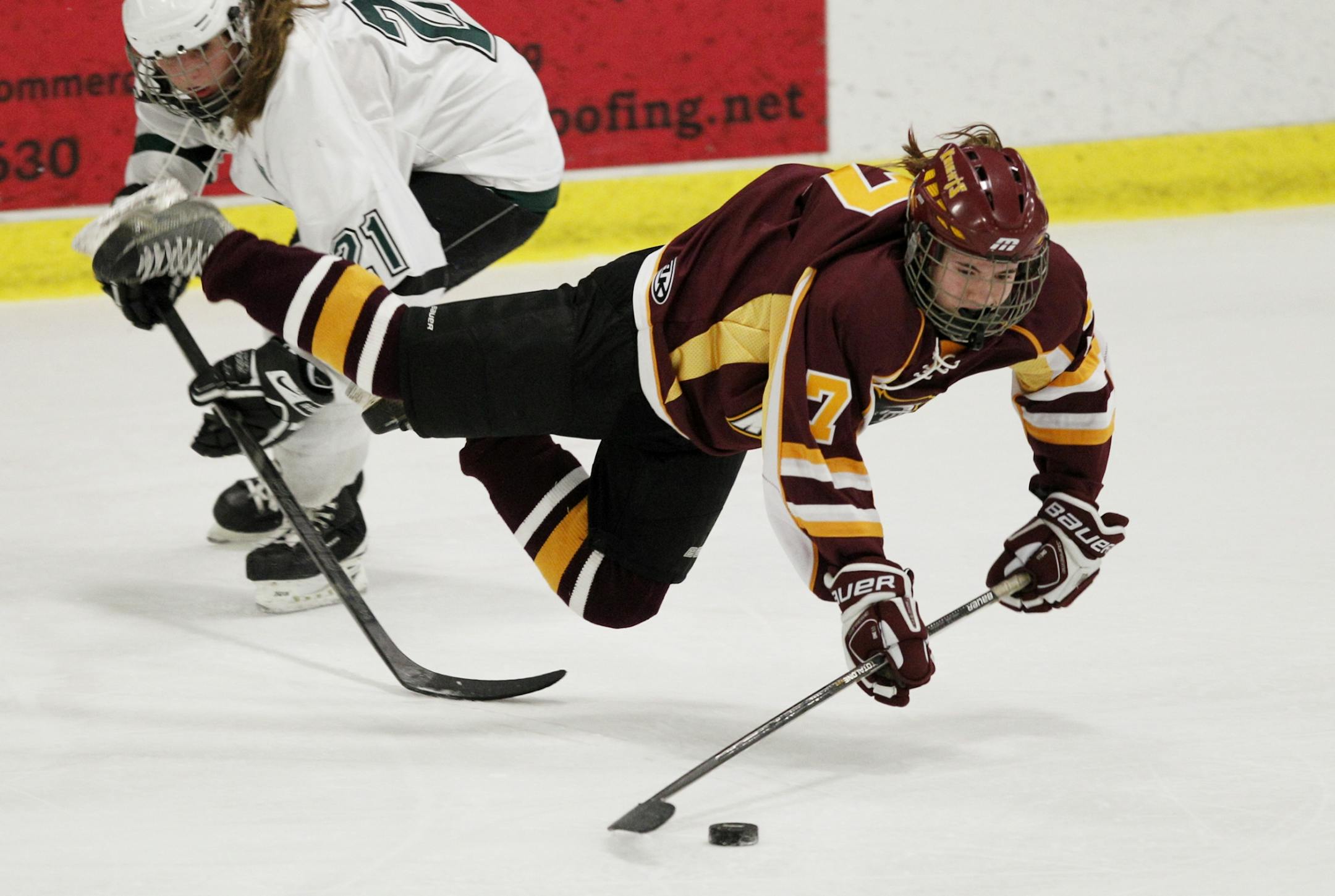 Mounds View's Lauren Klein, left, is called for a penalty after tripping up Irondale's Maddie Hentges.