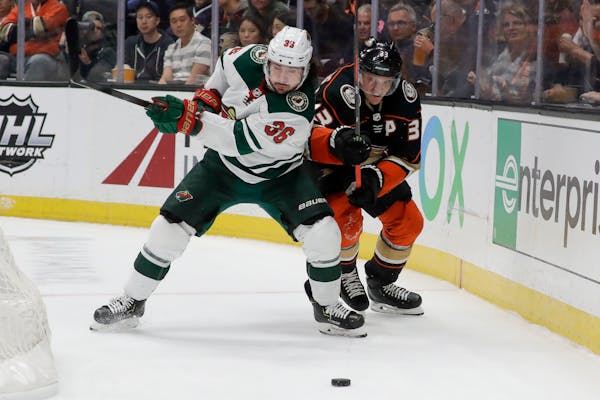 Wild center Mats Zuccarello, left, battled Ducks right winger Jakob Silfverberg for the puck during the second period Tuesday. Zuccarello had a goal a