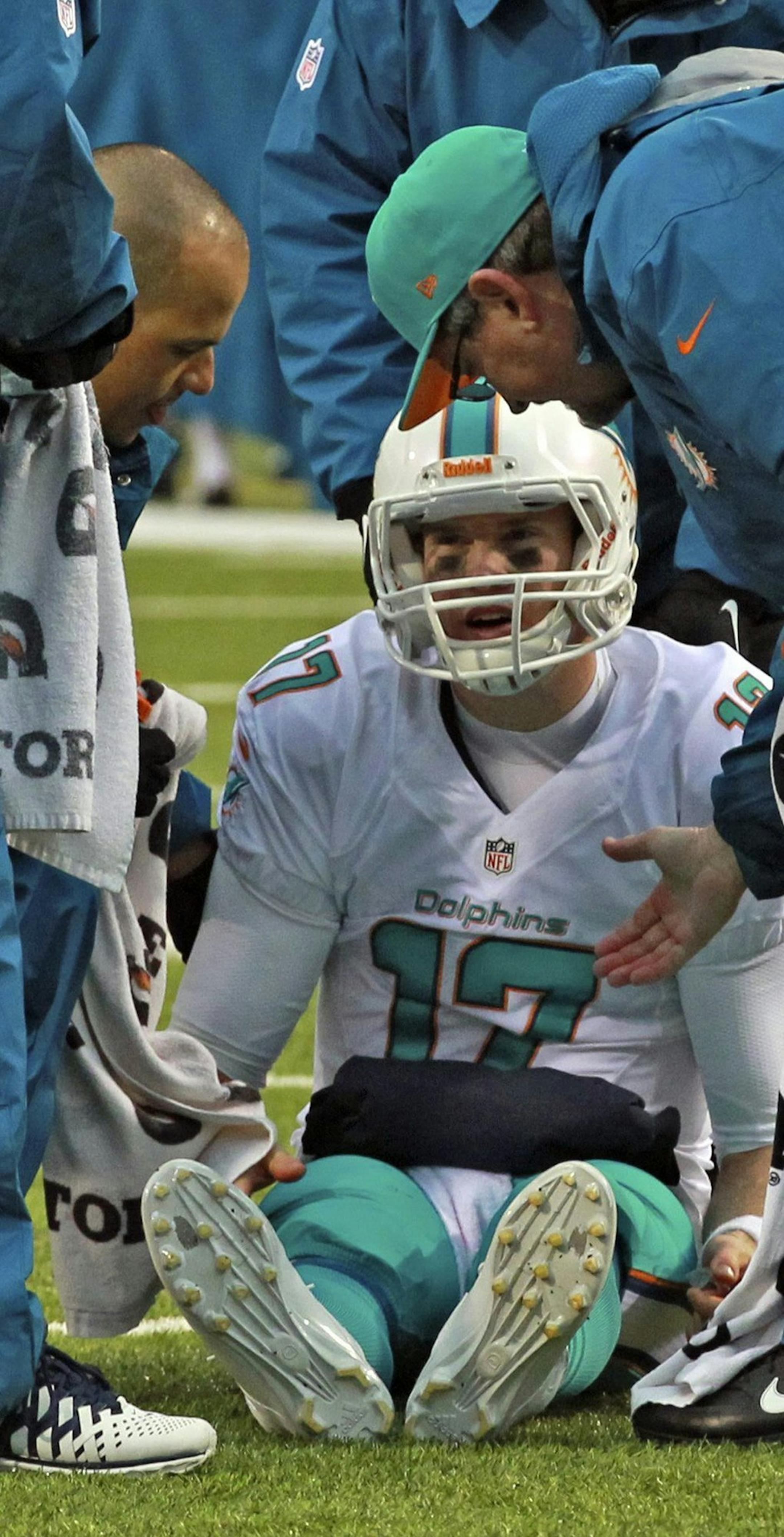 Miami Dolphins quaretrback sits on the field after being sacked by tje Buffalo Bills' Kyle Williams in the fourth quarter at Ralph Wilson Stadium in Buffalo, Sunday, Dec. 22, 2013. Tannehill limped off the field and was replaced by backup quarterback Matt Moore. The Bills defeated the Dolphins, 19-0. (Charles Trainor Jr./Miami Herald/MCT)