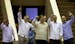 Members of "The Cuban Five," from left, Fernando Gonzalez, Rene Gonzalez, Ramon Labanino, Antonio Guerrero and Gerardo Hernandez wave to members of th