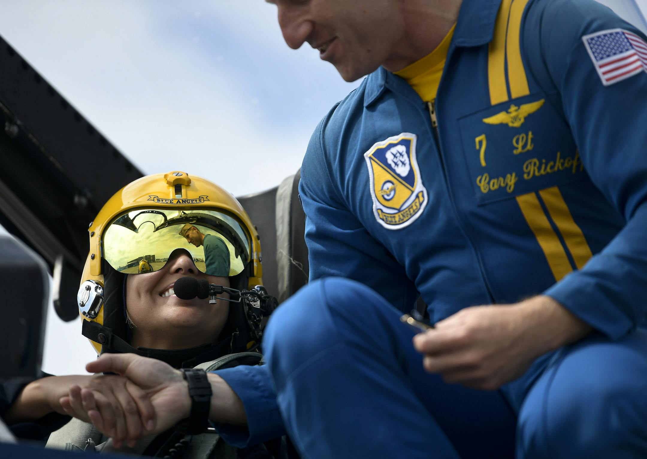 Blue Angels Pilot Lt. Cary Rickoff shook hands with Minnesota Teacher of the Year Jess Davis before her flight Wednesday afternoon. ] Aaron Lavinsky ¥ aaron.lavinsky@startribune.com On the eve of the annual Duluth Air Show, staff writer Pam Louwagie and Minnesota Teacher of the Year Jess Davis fly with the Blue Angels. We photograph Louwagie and Davis on Wednesday, July 17, 2019 at the Duluth International Airport in Duluth, Minn.