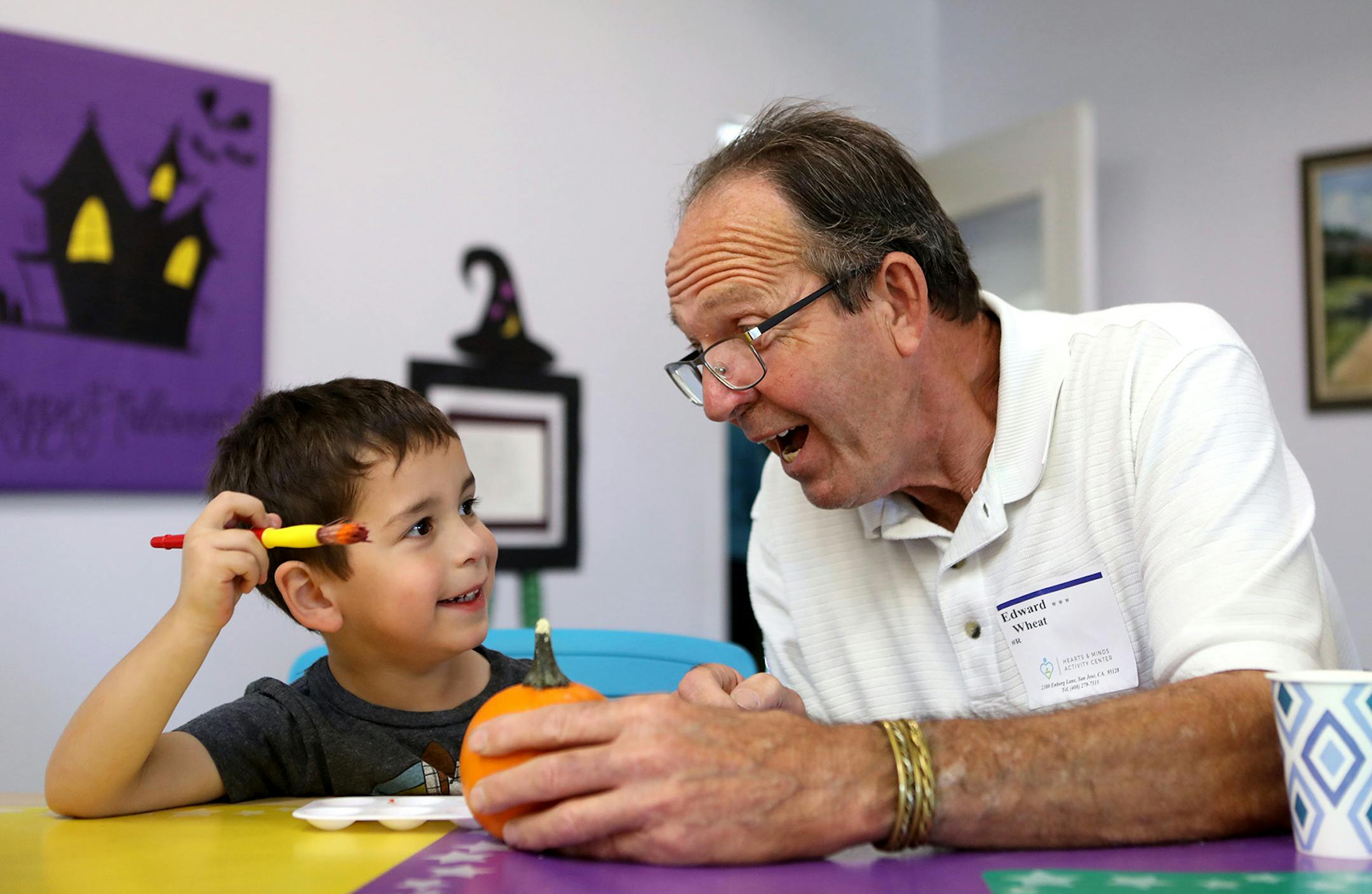 Hayden Meyers, 4, and Edward Wheat decorate a tiny pumpkin during an activity at Hearts & Minds Activity Center in San Jose, Calif., on Thursday, Oct. 24, 2019. (Anda Chu/Bay Area News Group/TNS) ORG XMIT: 1513654