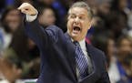 Kentucky head coach John Calipari directs his players in the first half of an NCAA college basketball game against Alabama in the semifinals of the So