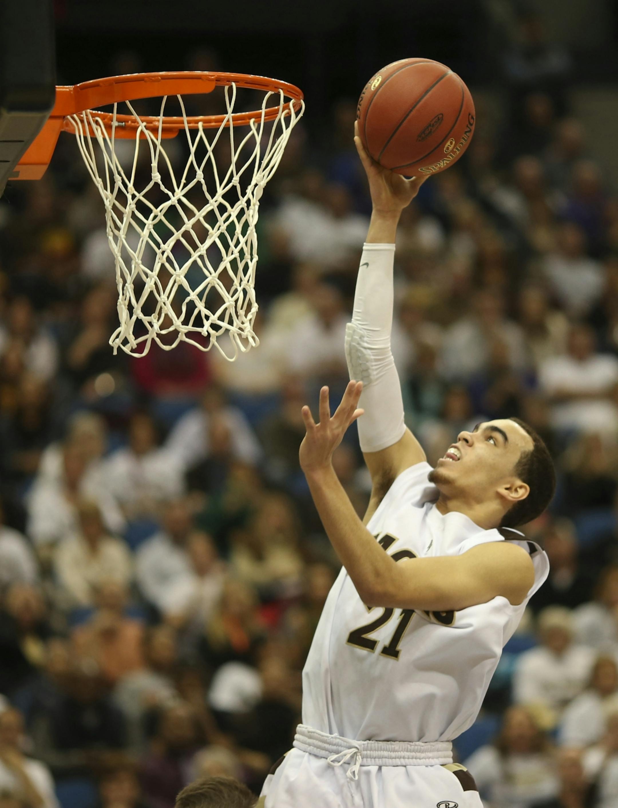 Apple Valley beat Eden Prairie 62-55 in their Class 4A Boys' Basketball State Tournament semifinal game Thursday night, March 21, 2013 at Target Center in Minneapolis. Tyus Jones of Apple Valley with a second half layup. He led all scorers with 23 points in the Eagles' win.