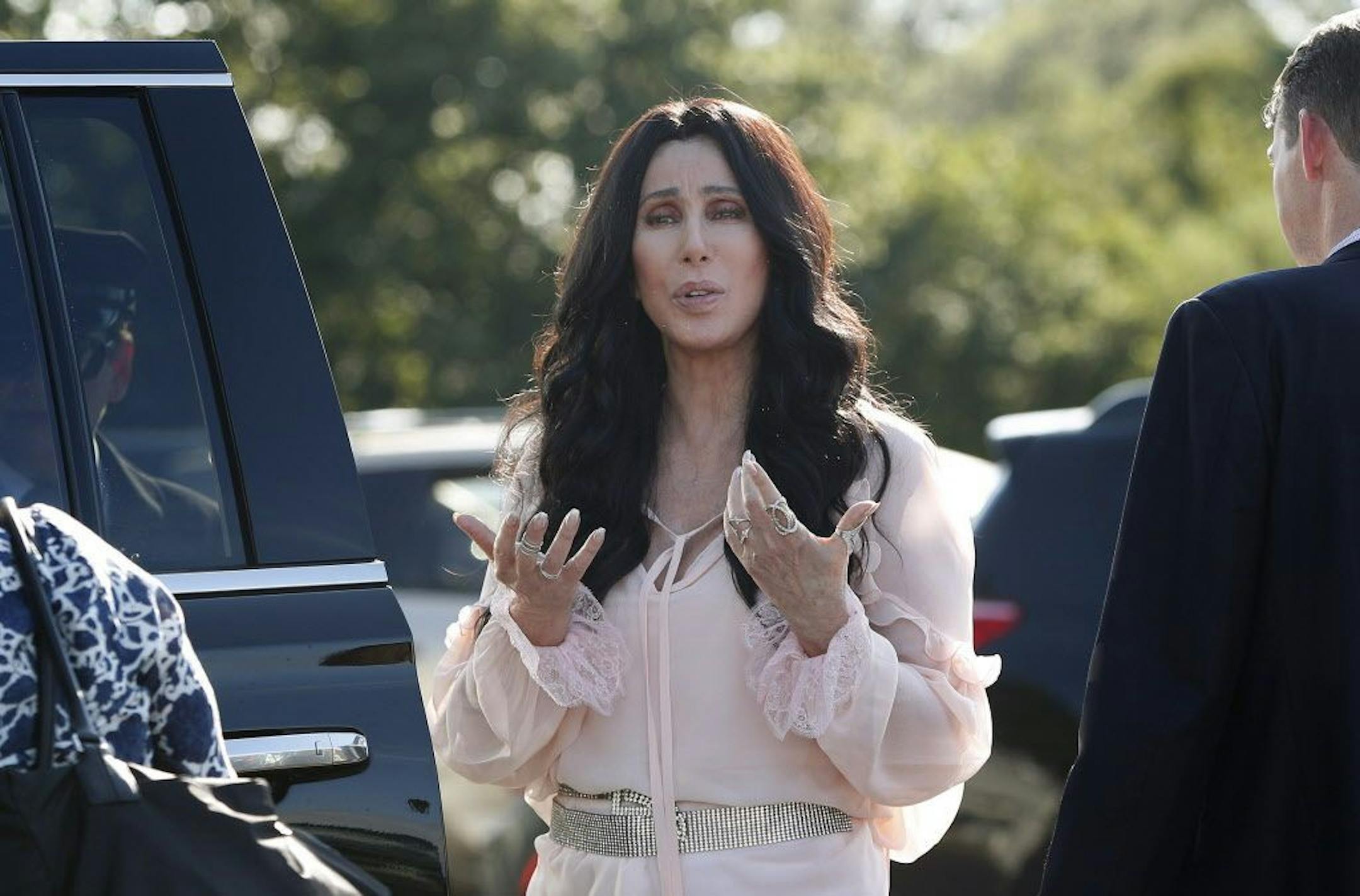 Singer and actress Cher stops to talk to media as she leaves a fundraiser for Democratic presidential candidate Hillary Clinton at the Pilgrim Monument and Provincetown Museum in Provincetown, Mass., Sunday, Aug. 21, 2016.