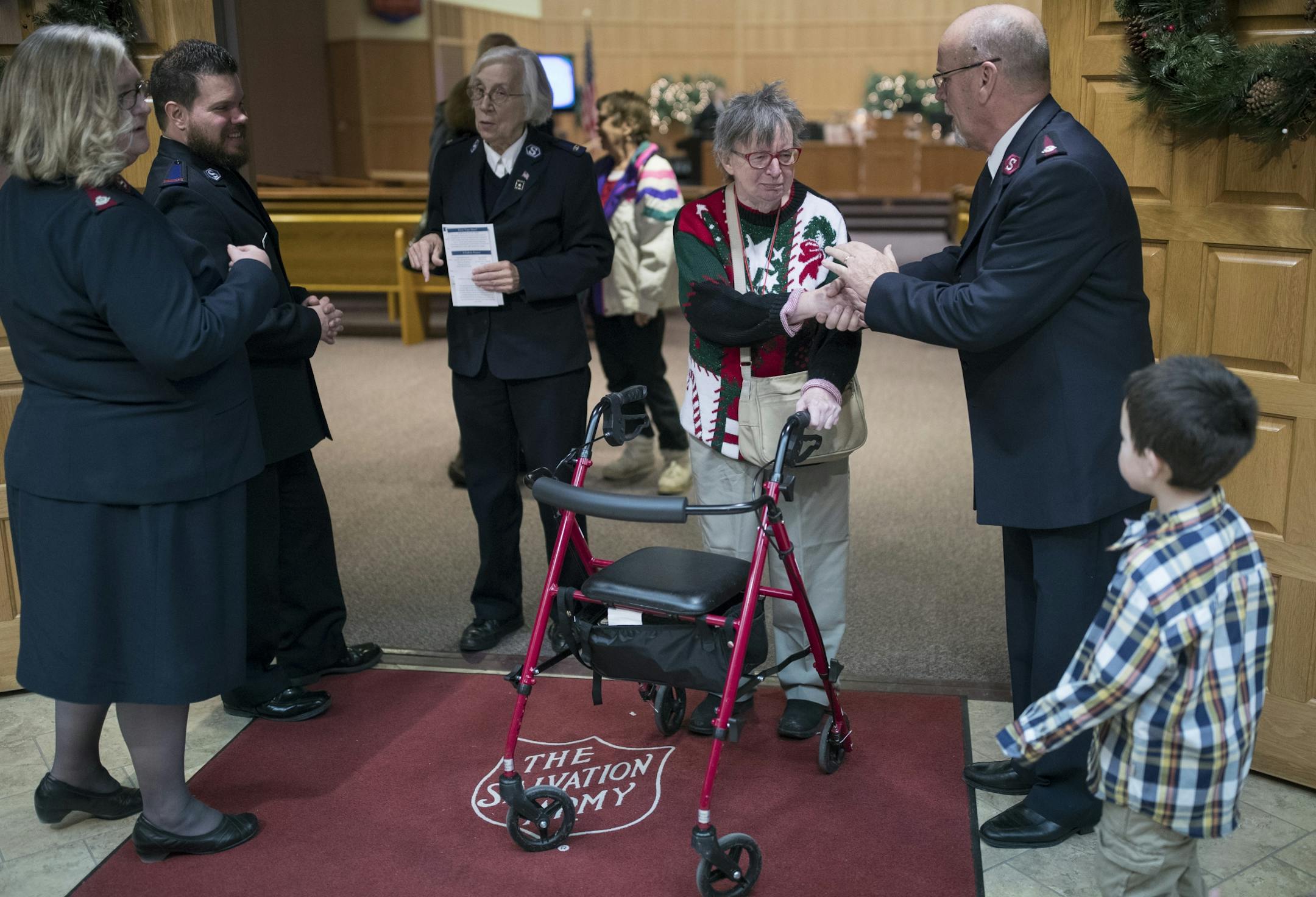 Major Jim Curl said goodbye to Jane Mortensen after worship services at the Salvation Army Center Sunday December 10, 2017 in Maplewood MN.