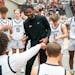 Trevor Mbakwe talks with the Eden Prairie boy’s basketball team during a timeout in the first half of their game against Farmington Friday, Dec. 16,