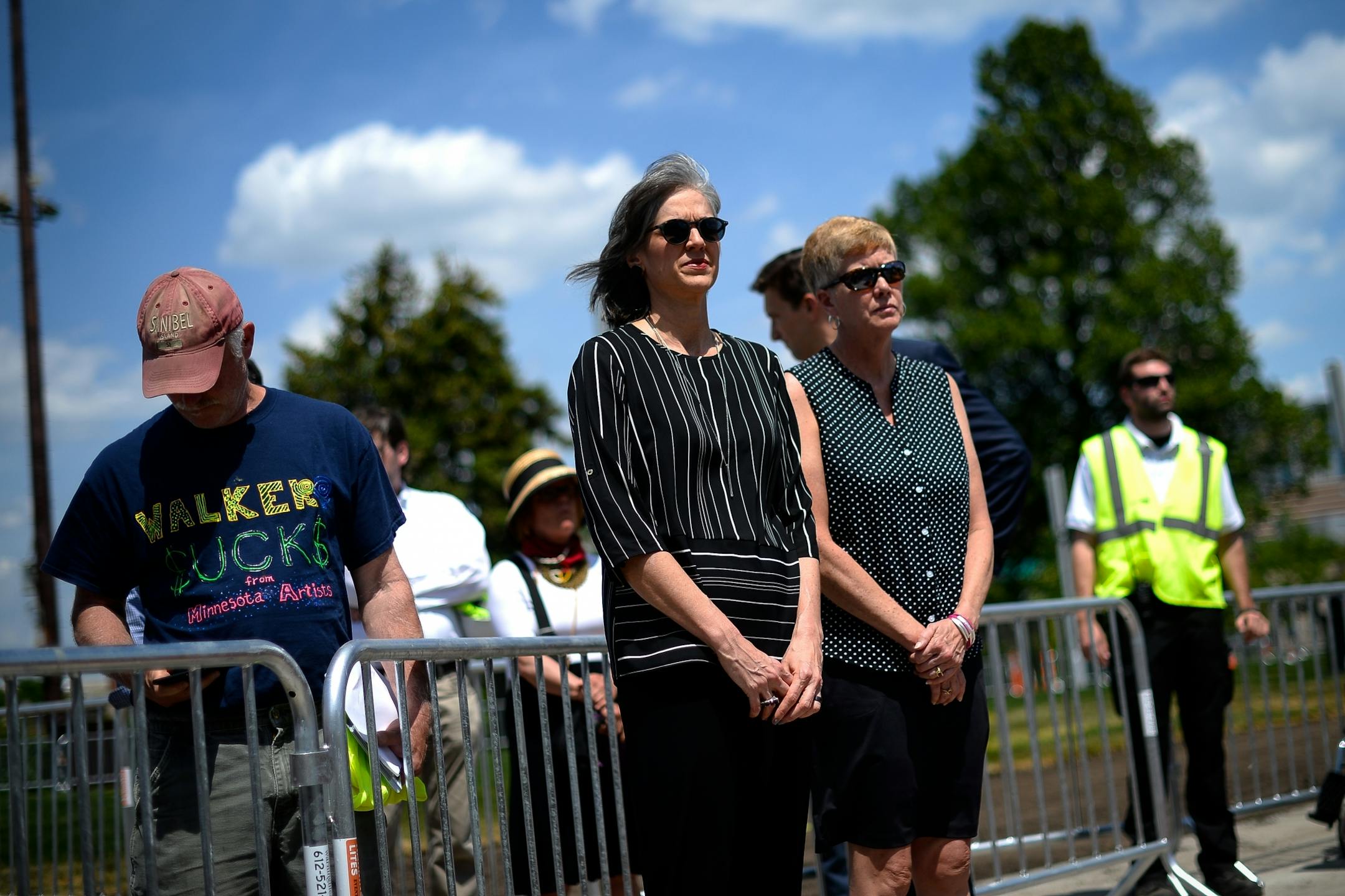 Walker Art Center director Olga Viso, center, and Minneapolis Park Board Superintendent Jayne Miller listened in as tribal leaders spoke during a press conference preceding the dismantling ceremony of the "Scaffold" sculpture Friday afternoon.