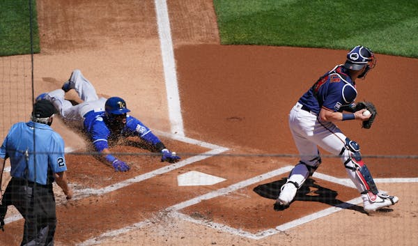 Kansas City Royals first baseman Carlos Santana (41) scored off a double hit by Salvador Perez in the first inning.