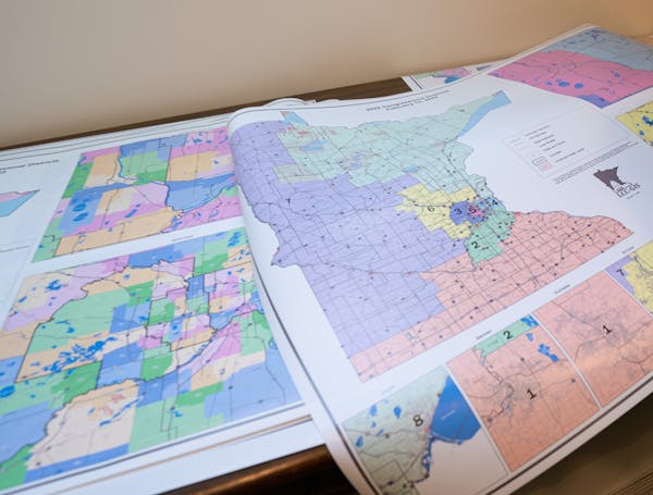 Julius Menchikov was busy printing and mounting huge copies of Minnesota’s new redistricting map on Tuesday in St. Paul.