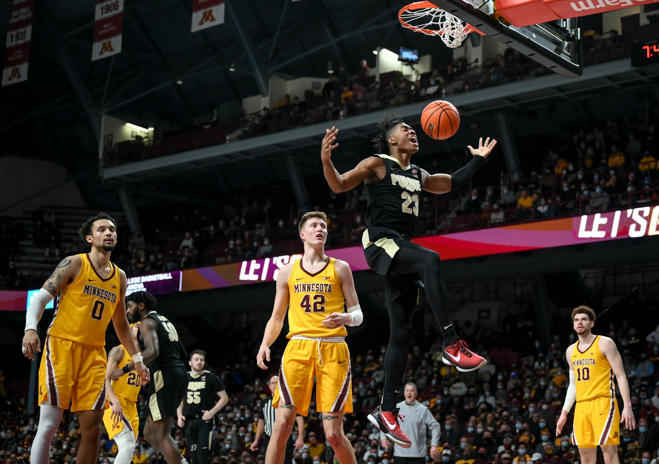 Purdue Boilermakers guard Jaden Ivey (23) dunks the ball late during the second half of an NCAA men's basketball game between Minnesota and Purdue at Williams Arena in Minneapolis, Minn.