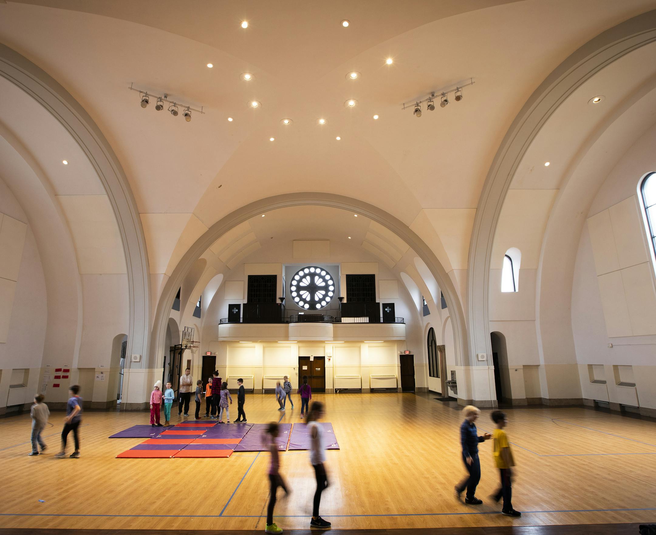 Students play during gym class. ] LEILA NAVIDI ¥ leila.navidi@startribune.com BACKGROUND INFORMATION: The Twin Cities German Immersion School in St. Paul on Monday, November 5, 2018. The school wants to tear down the building, the former St. Andrew's Catholic Church, to erect a modern school building to accomodate their growing student population, but some neighbors want to designate the church as an historic site.