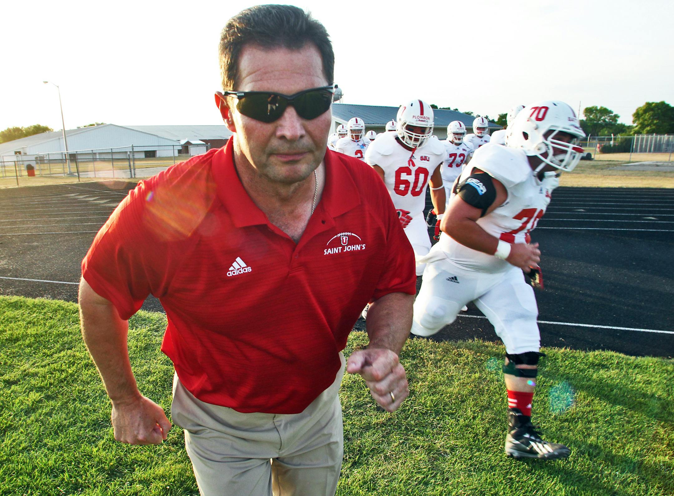 St. John's vs. UW River Falls football - first game under new St. John's head coach Gary Fasching. Fasching led the Johnnies onto the field for the start of the game. (MARLIN LEVISON/STARTRIBUNE(mlevison@startribune.com)