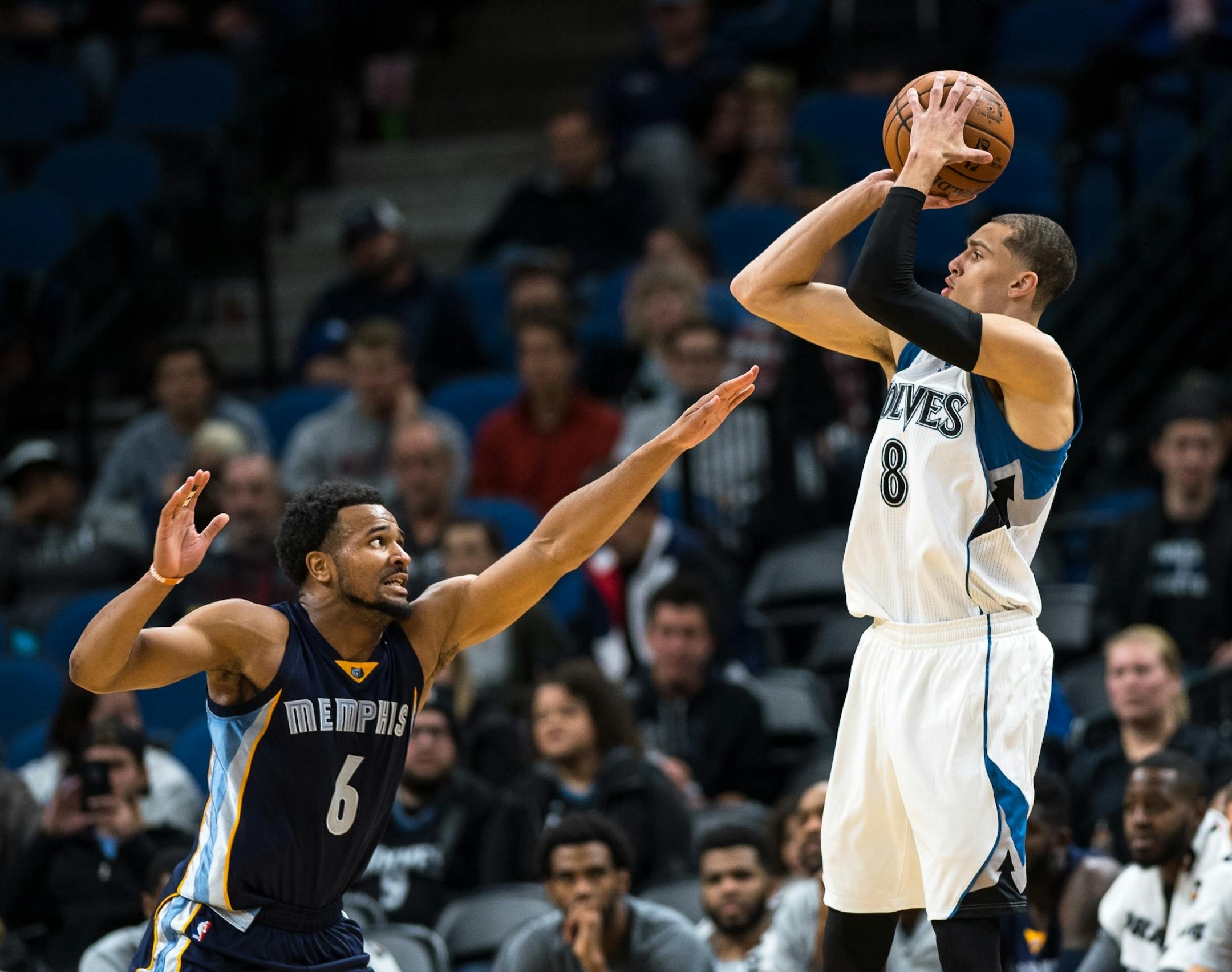 Minnesota Timberwolves guard Zach LaVine (8) sank a 3-point shot under the defense of Memphis Grizzlies Chris Crawford in the third quarter Wednesday.