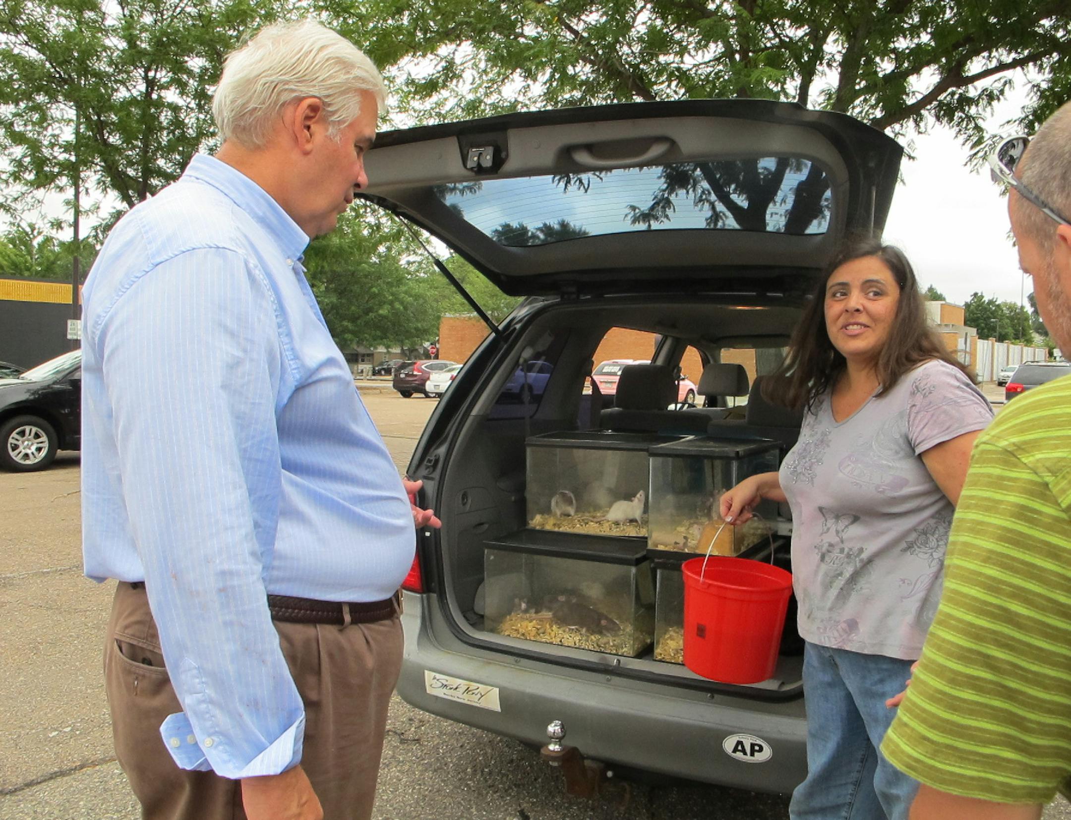 By Erin Adler. Tim Shields, attorney with the Minnesota Federated Humane Societies, packs up rats with Lissa Muehlberg, a state humane agent.