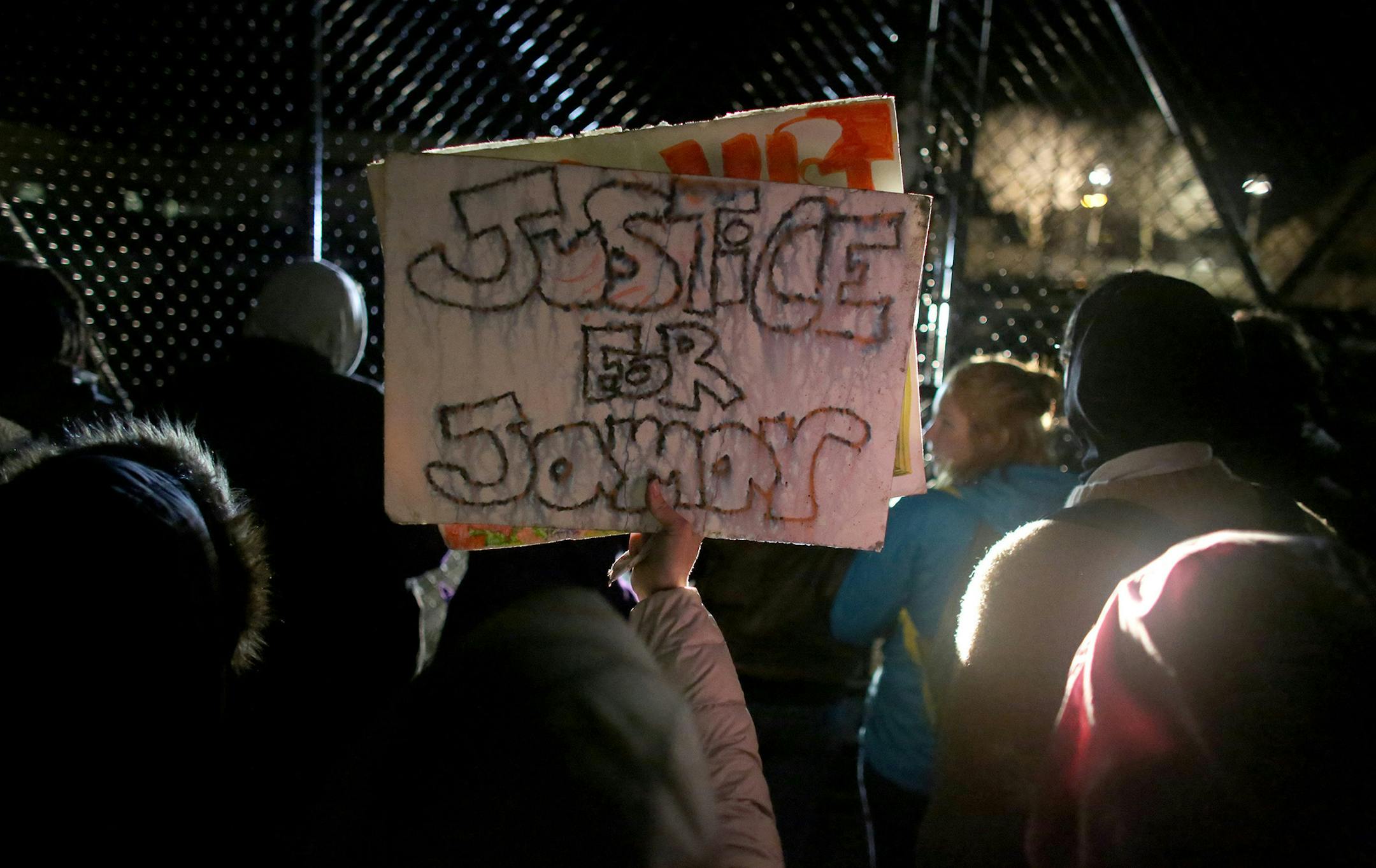 Protesters moved to the gated parking lot of the Minneapolis Fourth Precinct to chant during their outside occupation outside surrounding area. ] (KYNDELL HARKNESS/STAR TRIBUNE) kyndell.harkness@startribune.com Black Lives Matter protested in front of Minneapolis Fourth Precinct in Minneapolis Min., Wednesday November 18, 2015. ORG XMIT: MIN1511182040590683 ORG XMIT: MIN1512151156030539 ORG XMIT: MIN1601041155570335