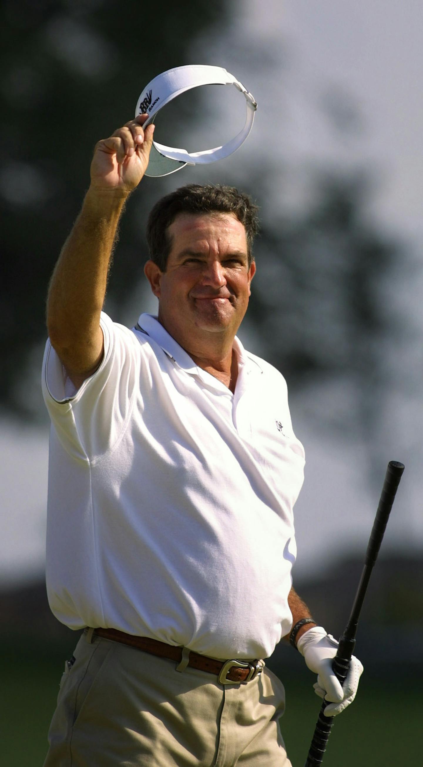 Bruce Lietzke, of Dallas TX. tipped his hat to the cheering crowd after sinking his put on the 18th green to win the 2001 3M Championship at the TCP Twin Cities Sunday afternoon.