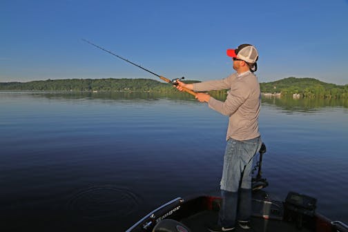 Dominic Schneider of Maplewood cast for muskies Saturday on the border water opener for those big fish.