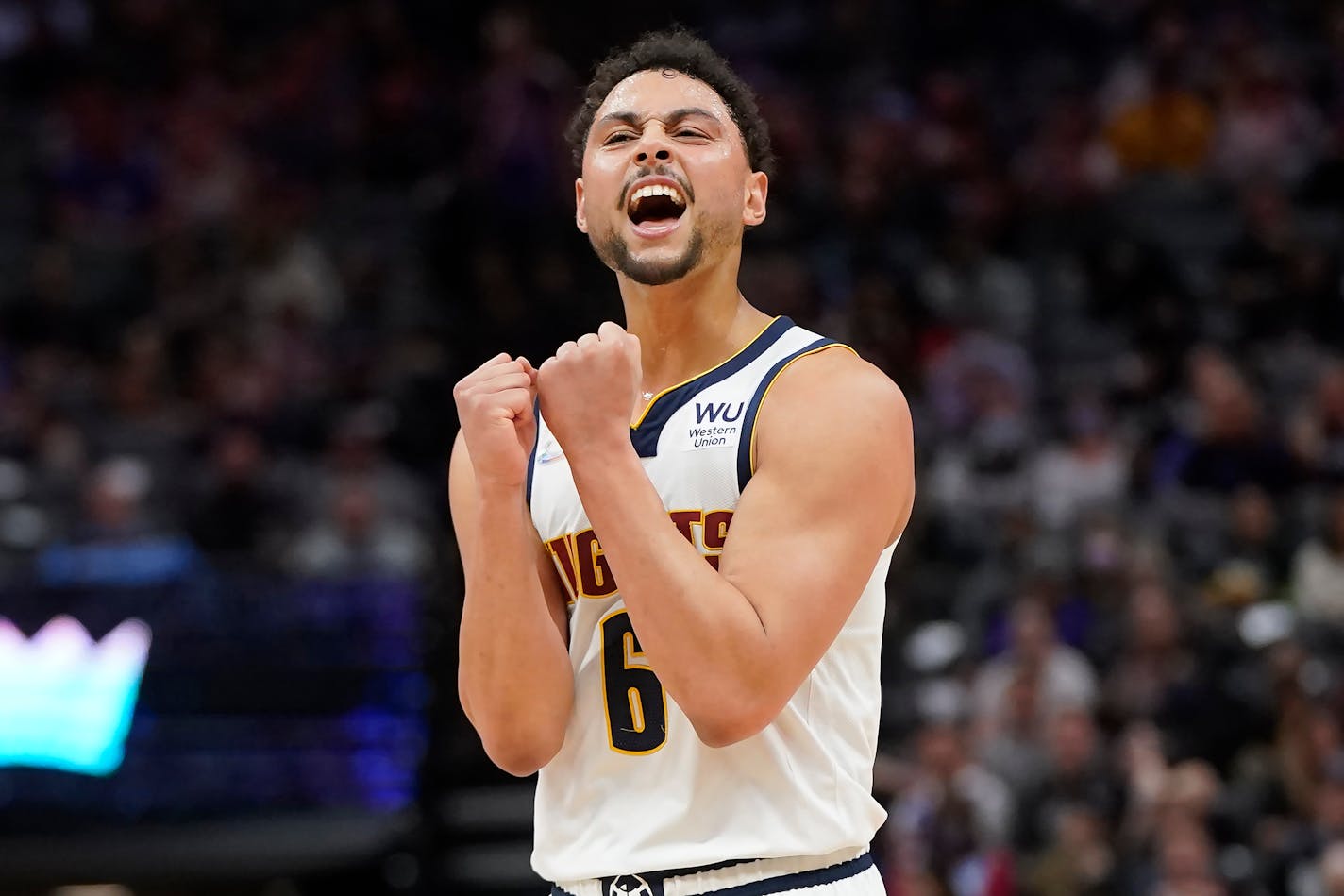 Denver Nuggets guard Bryn Forbes reacts after teammate Aaron Gordon scored against the Sacramento Kings during the first half of an NBA basketball game in Sacramento, Calif., Wednesday, March 9, 2022. (AP Photo/Jeff Chiu)