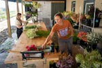 Owner Molly Gaeckle bunches cut flowers for wholesale market at Northerly Flora in Minneapolis on July 16.