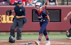 United South Central outfielder Carissa Hanson celebrates after scoring the game’s first run Friday in the Class 1A championship game at Jane Sage C