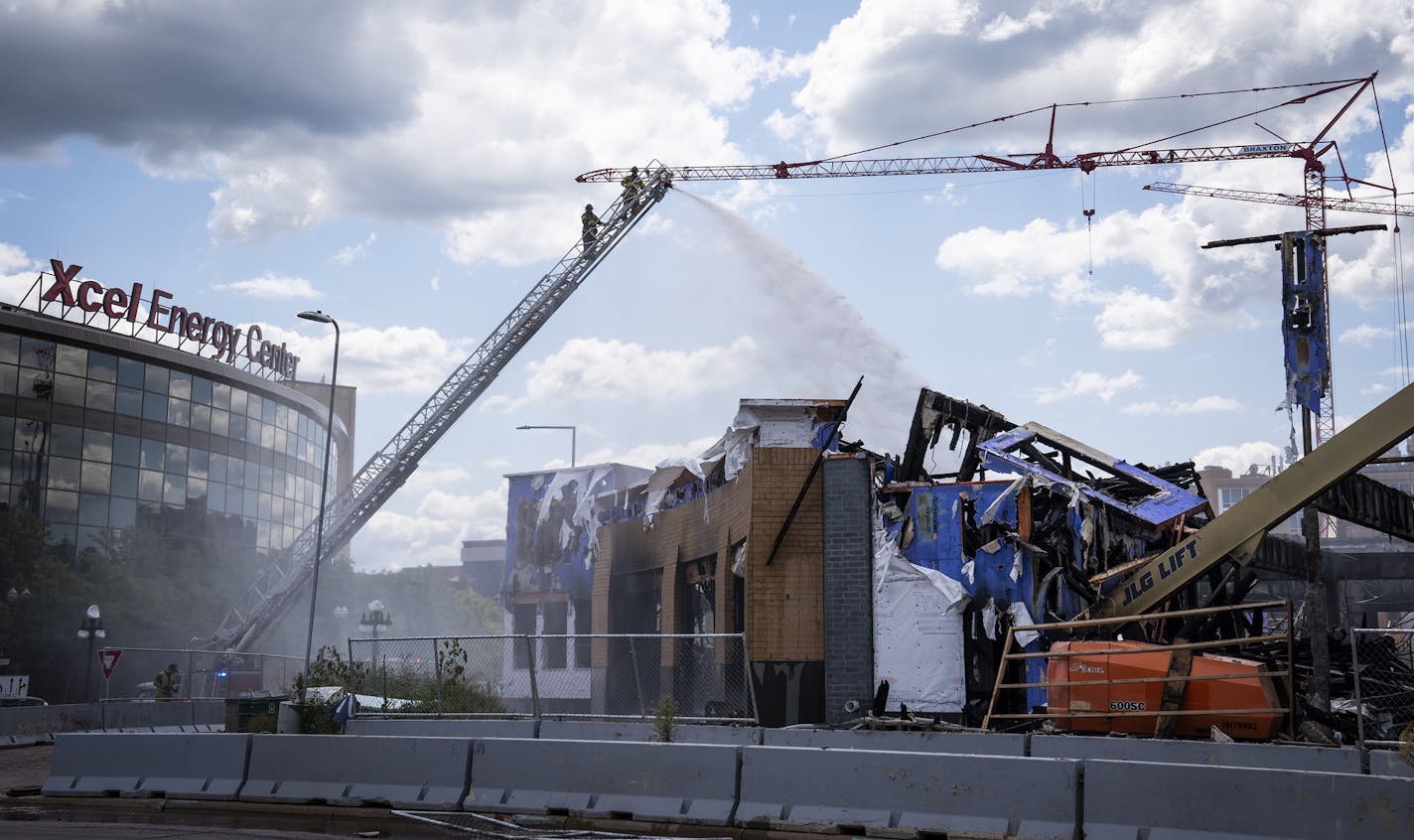 St. Paul firefighters battled a fire at a construction site across from Xcel Energy Center in downtown St. Paul. ] LEILA NAVIDI • leila.navidi@startribune.com BACKGROUND INFORMATION: St. Paul firefighters battled a fire in the afternoon at a construction project across from the Xcel Energy Center on Tuesday, August 4, 2020. A Courtyard by Marriott hotel and apartment complex under construction across the street from Xcel Energy Center in downtown St. Paul caught fire early Tuesday morning, resul