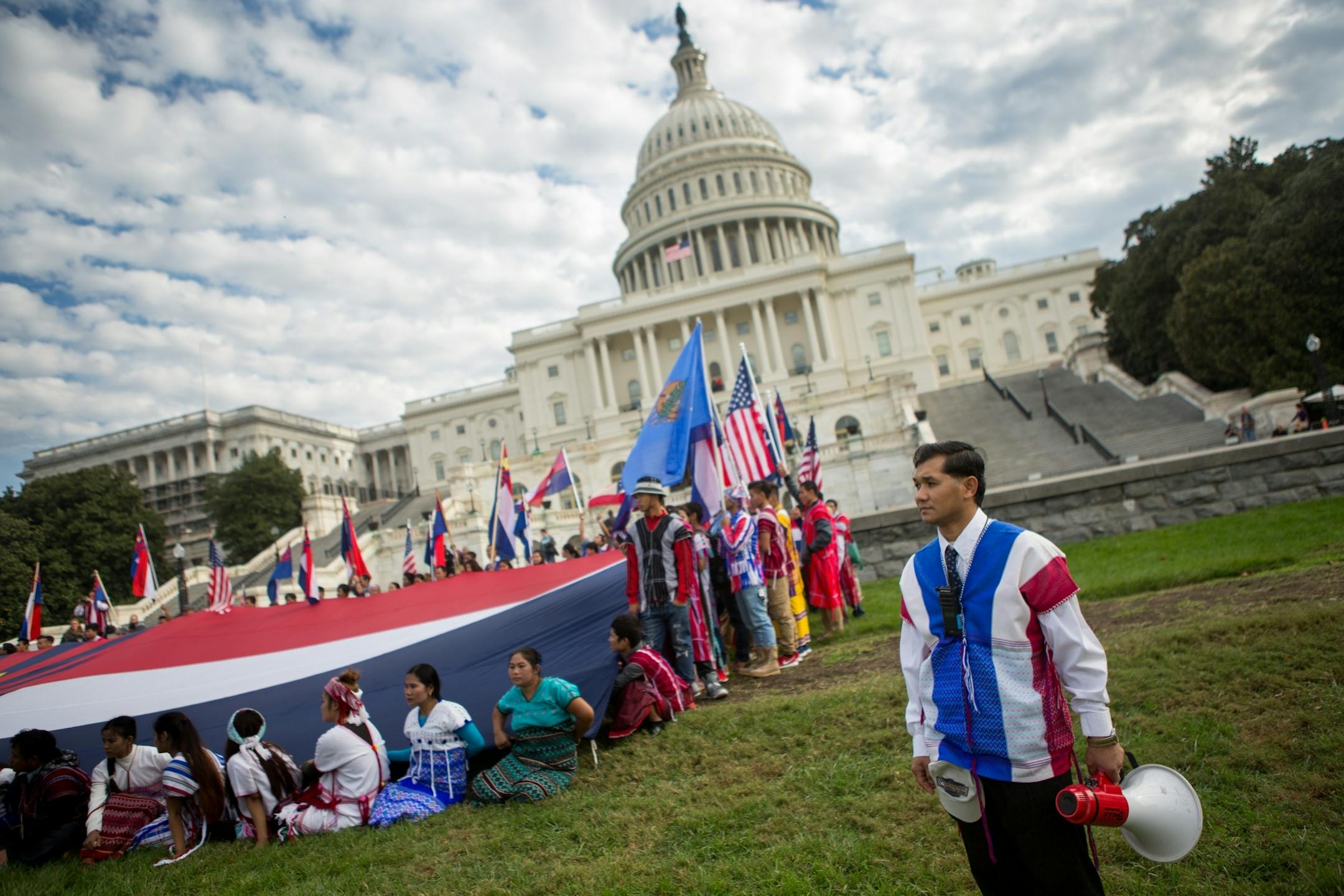Members of the Karen ethnic group hold a giant Karen flag as they rally to bring attention to the human rights violations towards religious and ethnic minorities in the Burma region, in front of the U.S. Capitol building on Capitol Hill in Washington, D.C., November 6, 2017. As resettlement of Karen refugees to the United States winds down, advocacy efforts have increased in support of more than 120,000 Karen who remain in Thai refugee camps.