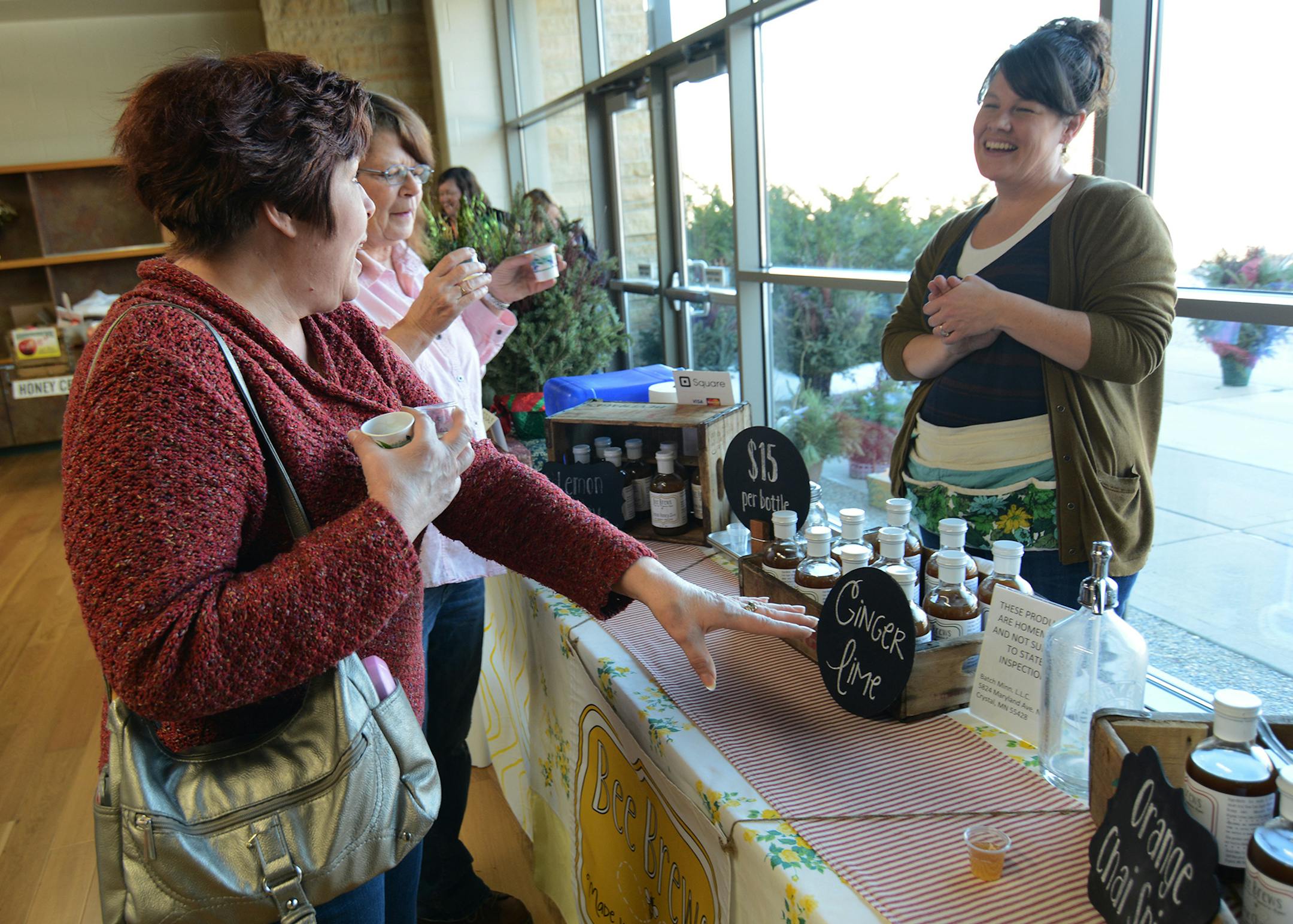 (left to right) Pam Zrust, of Hastings, and Dawn George, of Northeast Minneapolis, sampled some of Brandee Hanson‚Äôs Bee Brews syrups. Photo by Liz Rolfsmeier, Special to the Star Tribune